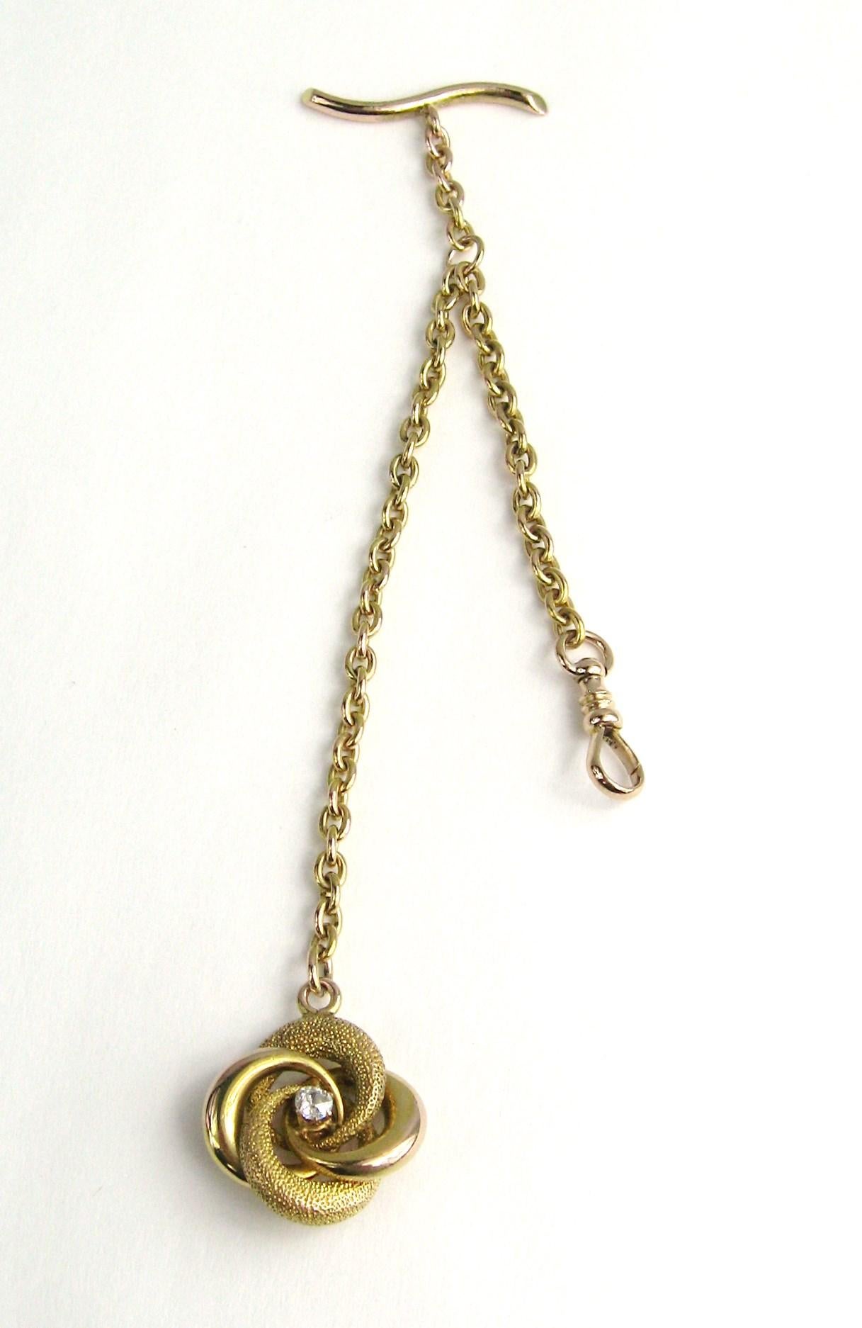 14K Gold Victorian Watch Chain. Chain Measuring 6 in. long with a Gold Knot that has a center rose cut diamond. The knot measuring .80