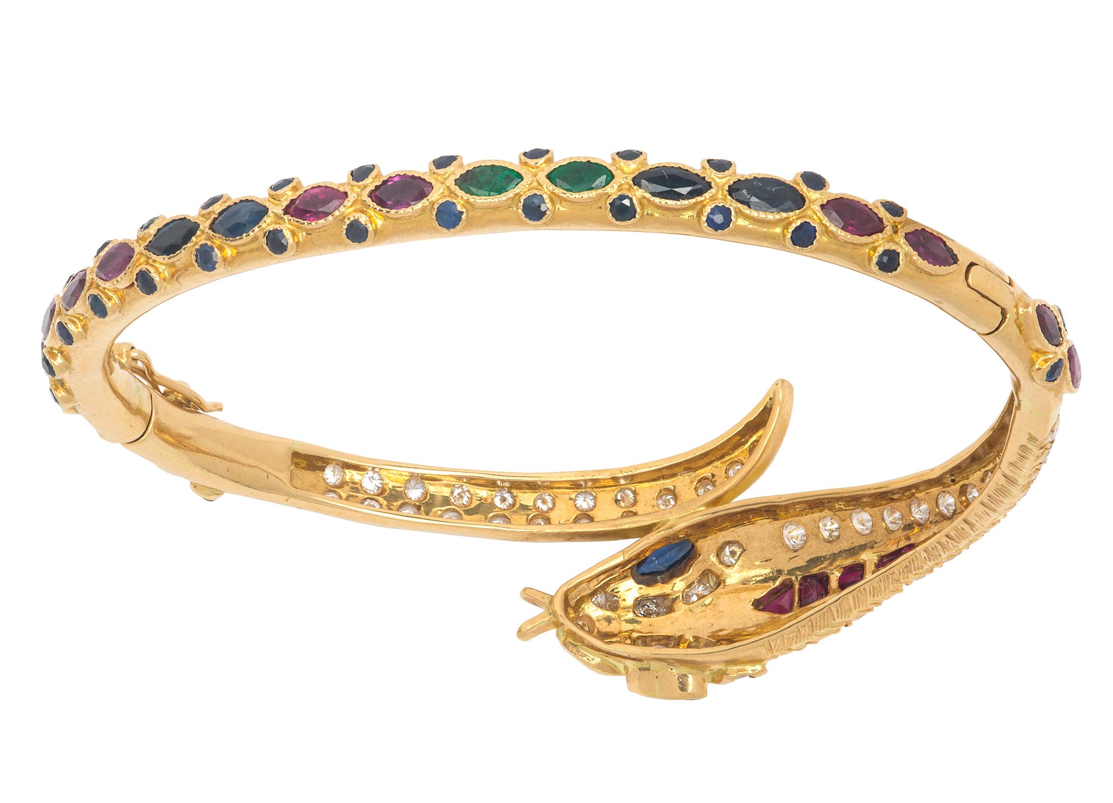 From estate collection.  14k yellow gold snake bracelet encrusted with 1.93 karats of diamonds.  And  sapphires, rubies and emeralds in various cuts of stone design.  
Band width is 4 millimeters, graduates to head and tail about 20 millimeter. 