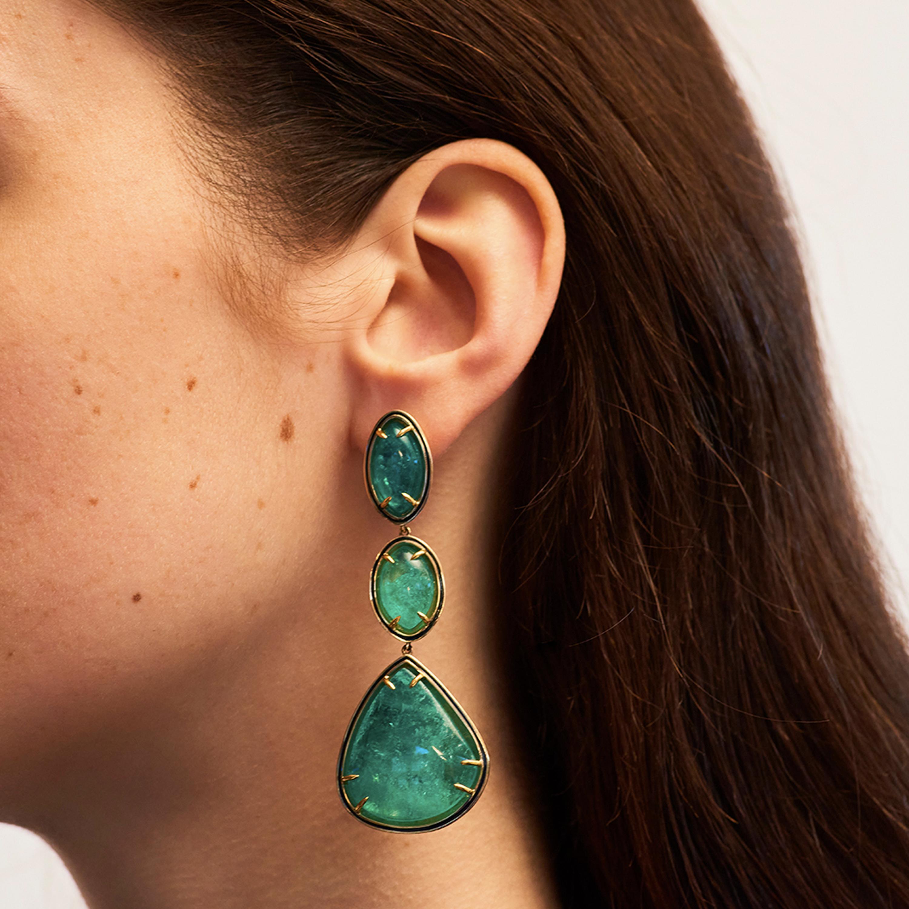 Alice Cicolini's Jaipur Muzo Colombian Emerald Wisteria Earrings feature three beautiful cabochon-cut Colombian Muzo emerald marquises, set in 14k yellow gold and white diamonds, graduating in size to form these drop earrings. The reverse features a