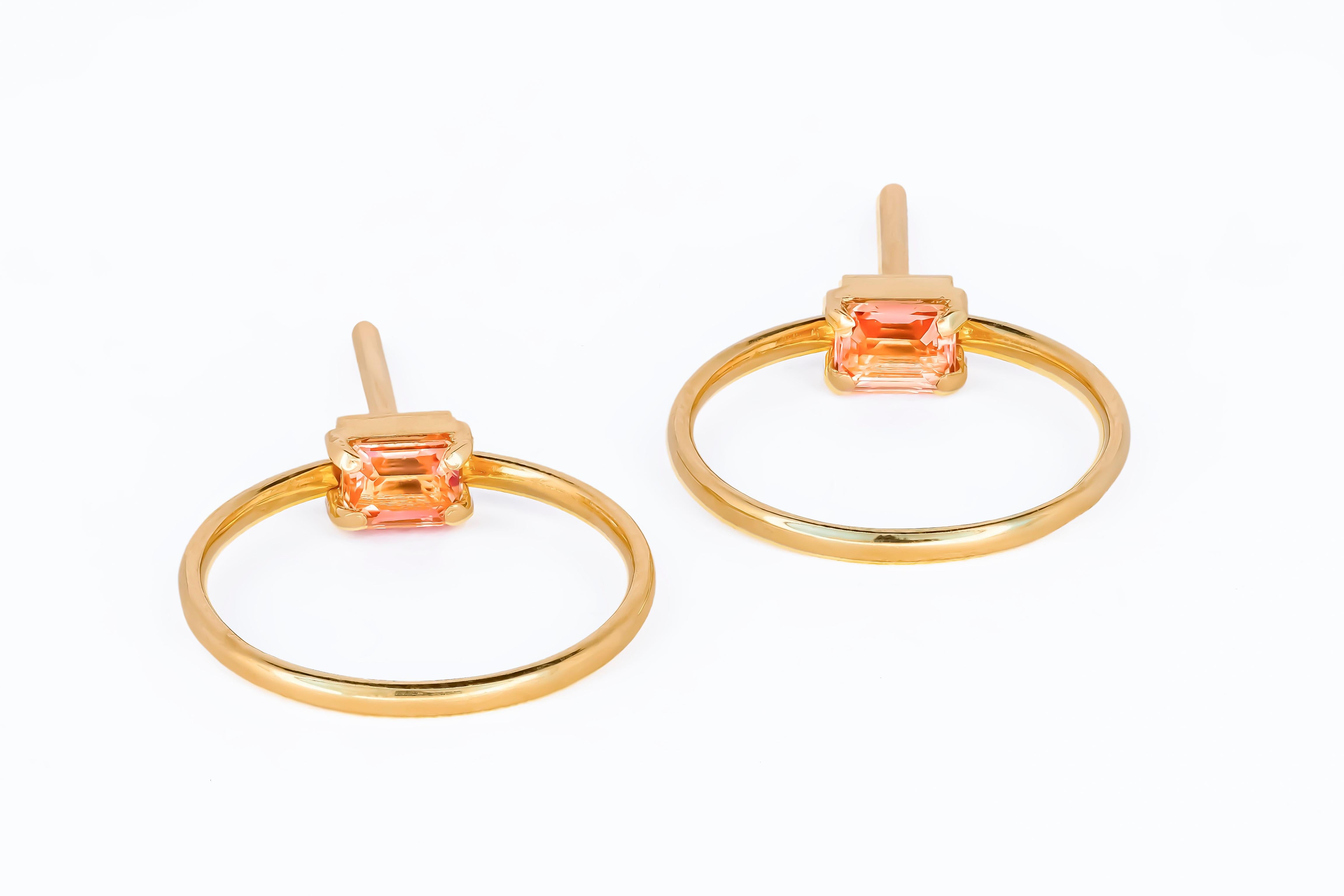 14 karat gold earrings studs with genuine sapphires. September birthstone. Genuine sapphire earrings.

Metal: 14 karat gold
Weight: 2.1 g.
Size: 16.5 x 16.5 mm.
Set with genuine sapphires: weight - 0.20 ct x 2 = 0.40 ct total.
Peach-pink color,