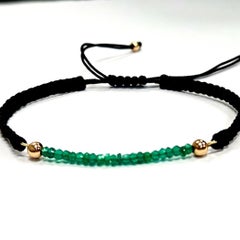 Bracciale unisex regolabile in oro 14 carati con smeraldo, Corde nere, lusso accessibile