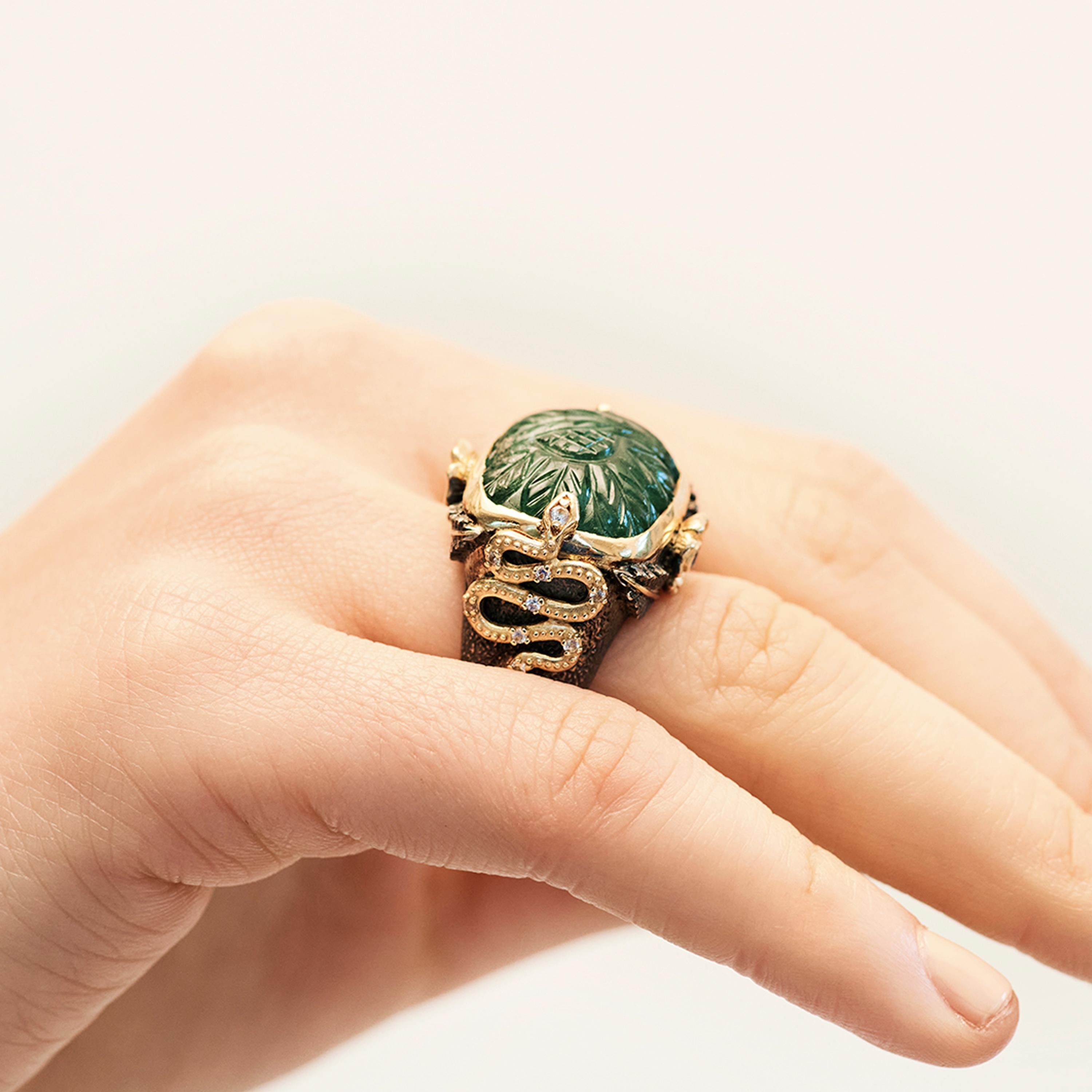 Invited into Stella’s world through a striking carved green emerald (26.27cts) carved with leaves, the Firenze Too ring is rich with colour, texture and narrative. Serpents surround the central stone, with white sapphires (0.43cts) set in their