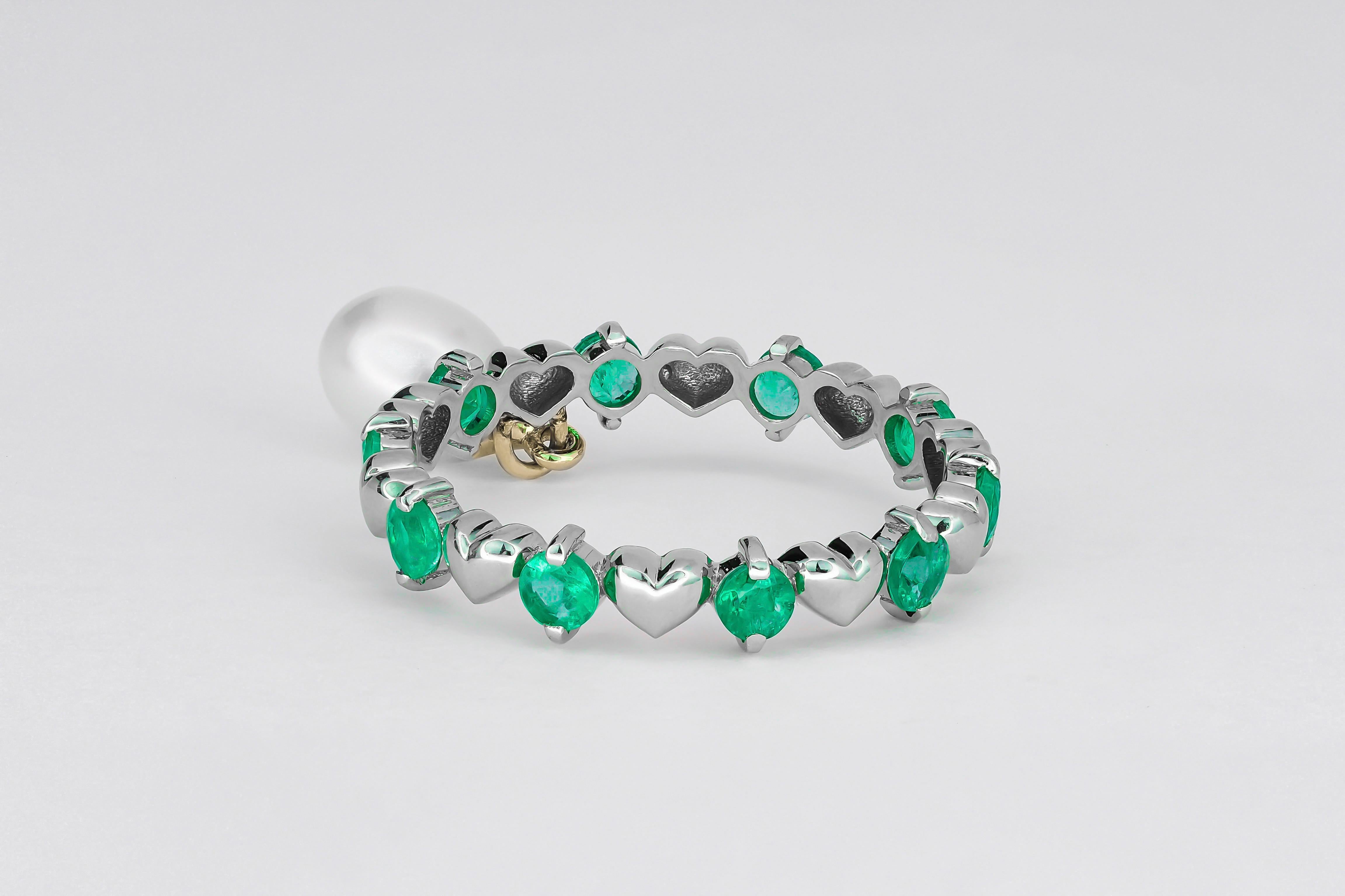 Round Cut 14 Karat Gold Eternity Ring with Emeralds and Pearl. Emerald Eternity Ring