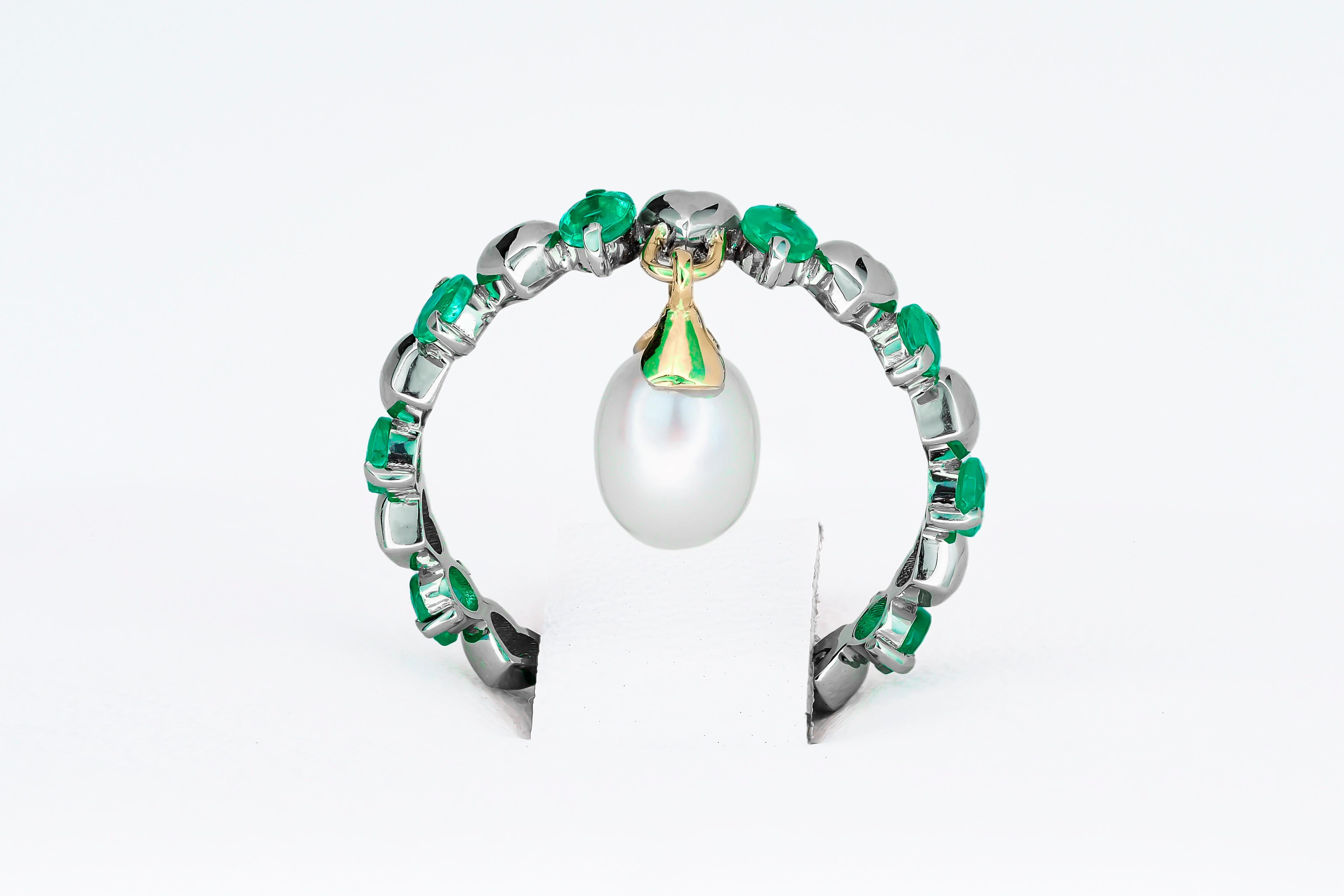 Women's 14 Karat Gold Eternity Ring with Emeralds and Pearl. Emerald Eternity Ring
