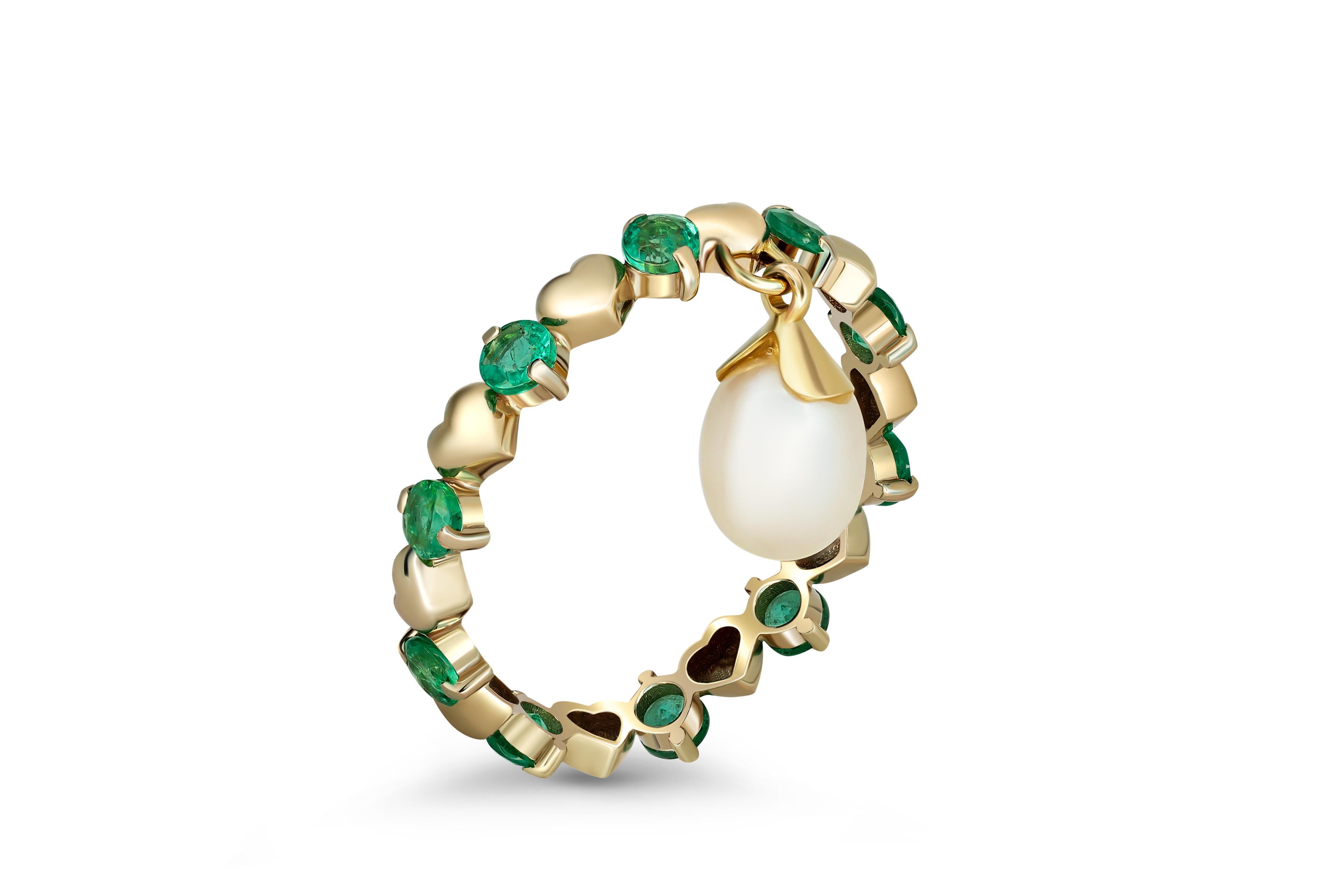 14 Karat Gold Eternity Ring with Emeralds and Pearl. Emerald eternity ring