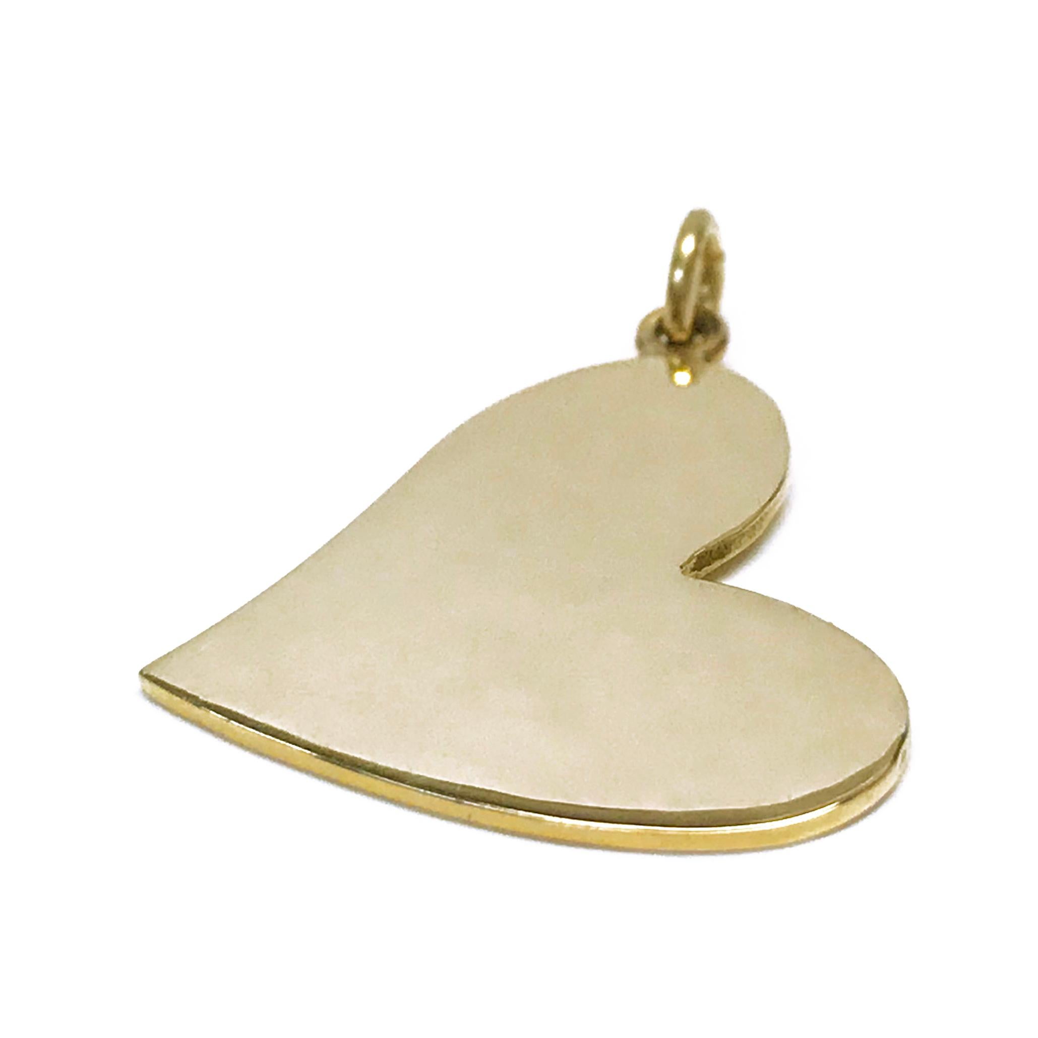 14 Karat Gold Heart-Shaped Pendant. A simple yet elegant design in a smooth finish all around. The total gold weight of the pendant is 2.18 grams.