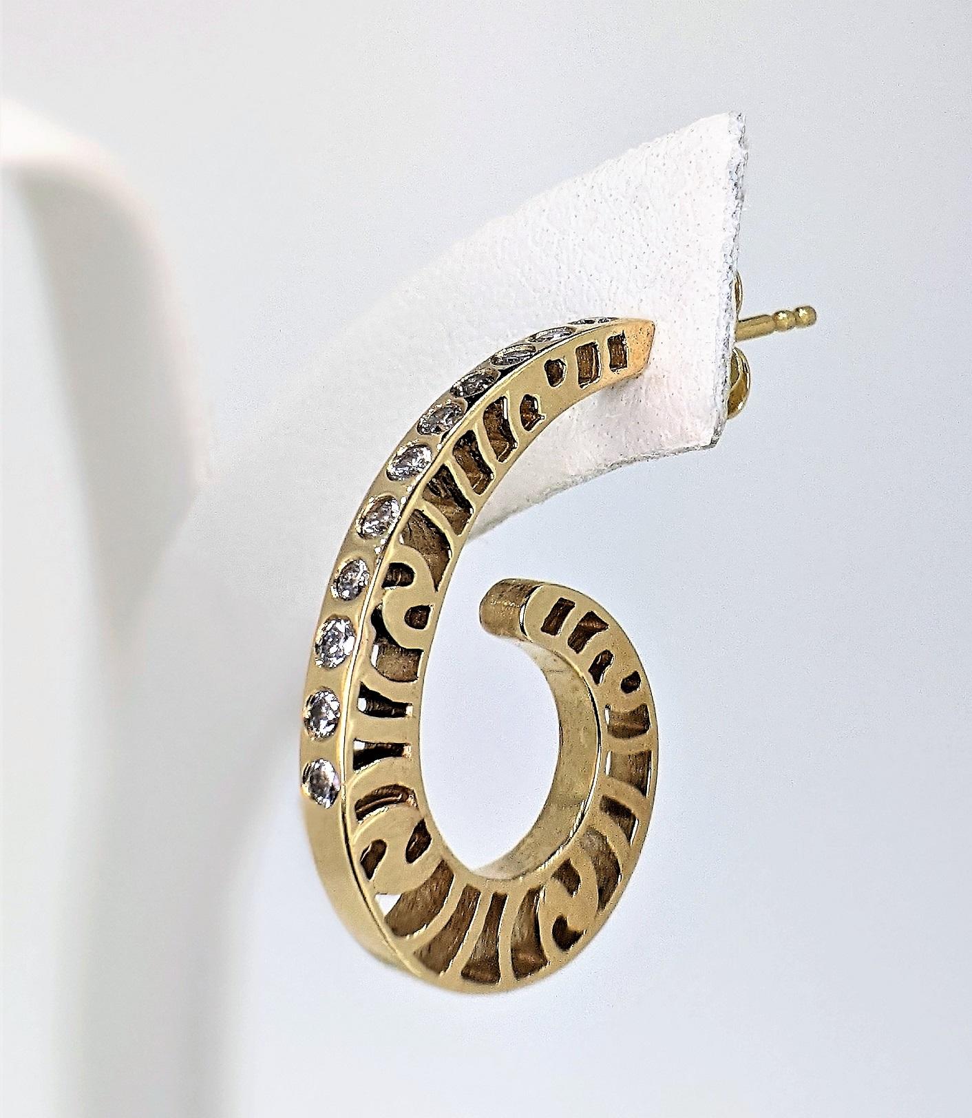 A great pair of hoop earrings takes you everywhere! And these  teardrop shaped hoops are just the right size and shape. The earrings are 14k yellow, with a high polish and each has 11 diamonds flush-set on it's spine. The sides are pierced with the