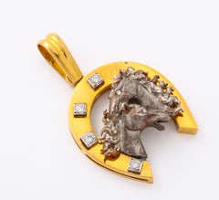 14 Karat Gold Horseshoe Pendant with 14 Karat White Gold Horses and Diamonds