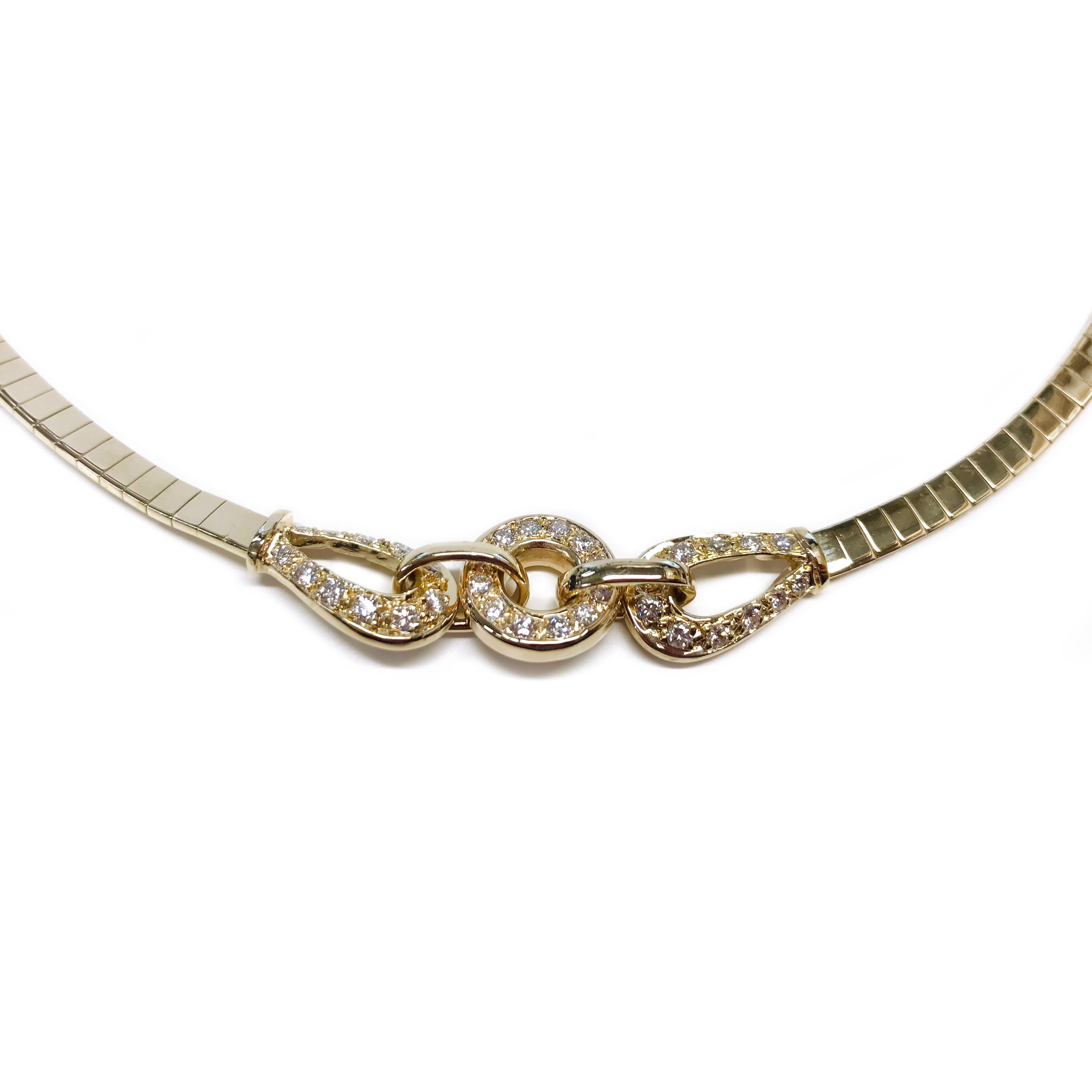 14 Karat Gold Italian Omega Diamond Necklace. The 4mm necklace features thirty-five pave-set 2mm round diamonds for a total carat weight of 1.03ctw. Stamped on the back of the clasp is 14K ITALY. The necklace has a box closure with a safety eight.
