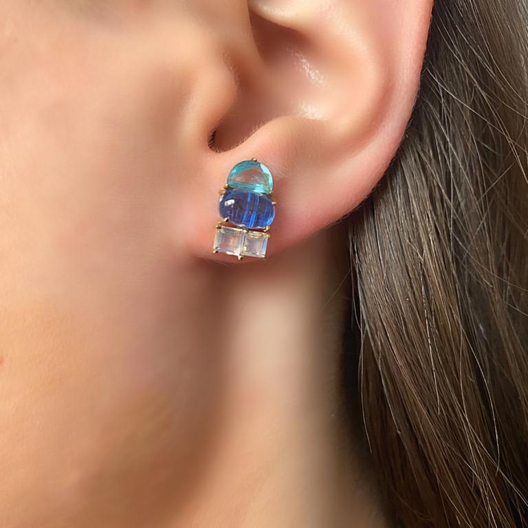 Cool colors are the story in this design.  These stud earrings feature multi-shaped stones. Icy blue Topaz squares are set against deep Kyanite ovals and blue Topaz half moons.  Interesting in both shape and color,  these are fashionable stud