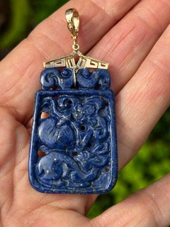 14 karat gold, lapis lazuli Chinese Lucky Fish Carved Pendant, Enhancer Bail