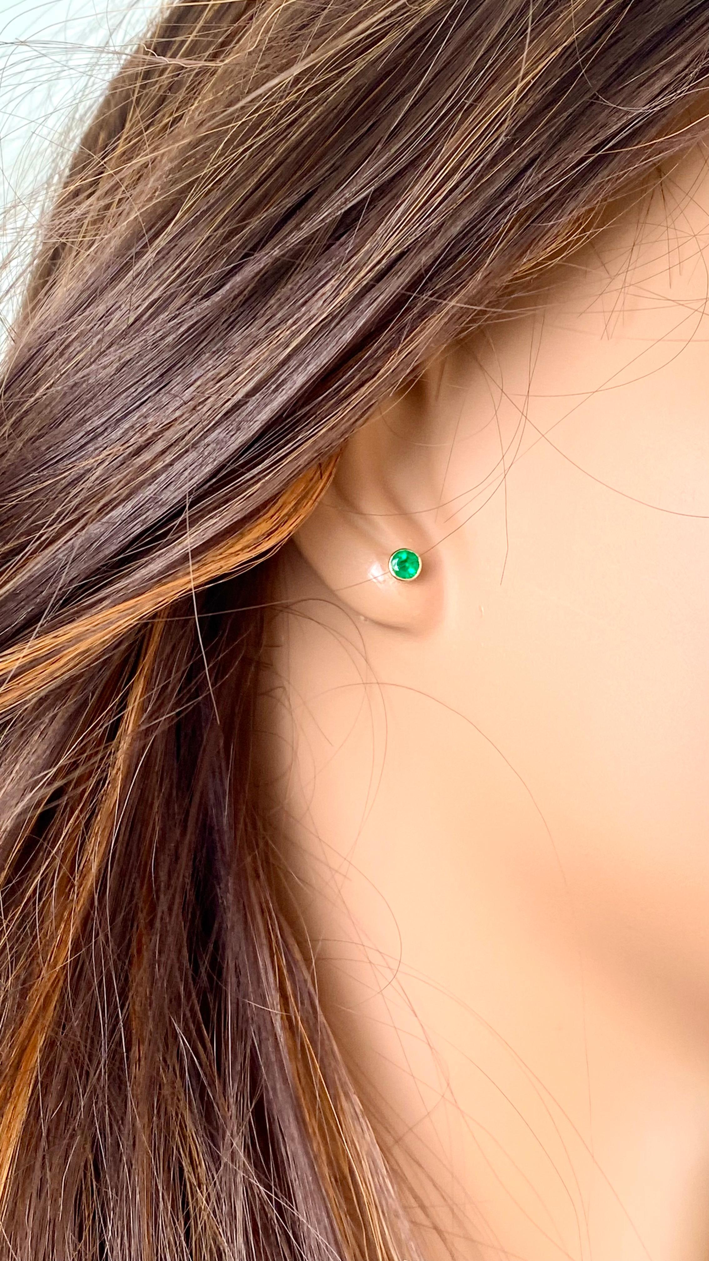 Introducing our exquisite 14 Karat Yellow Gold Matched Pair Round Emerald Stud Earrings, a timeless addition to your jewelry collection. Crafted with the finest attention to detail, these earrings boast a captivating design that combines elegance