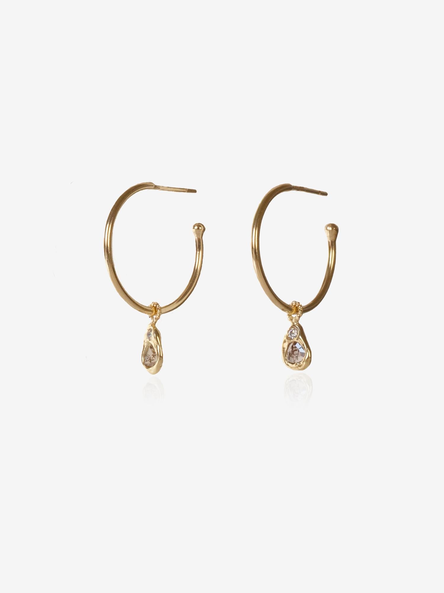 Your new favorite hoops. Lightweight and ultra comfortable, these hoops come with removable charms.  Charms feature rose-cut diamond slices and 1.2mm-1.5mm ethically sourced round diamonds. Wear them with or without charms for a versatile look. 
•