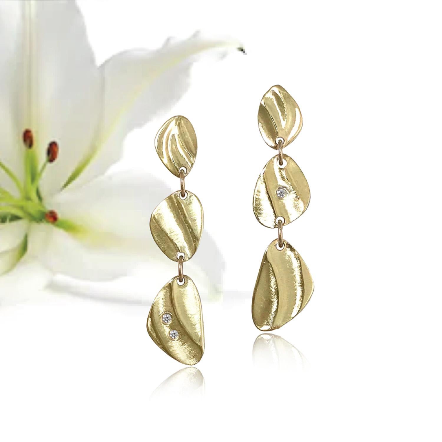 K.Mita's modern Mini Pebble Dangle Earrings from her Sand Dune Collection are handmade by the artist from 14 Karat Yellow Gold. The contemporary earrings, which are 31 mm long and 8 mm wide, are accented with three Diamonds (0.03 Carats total