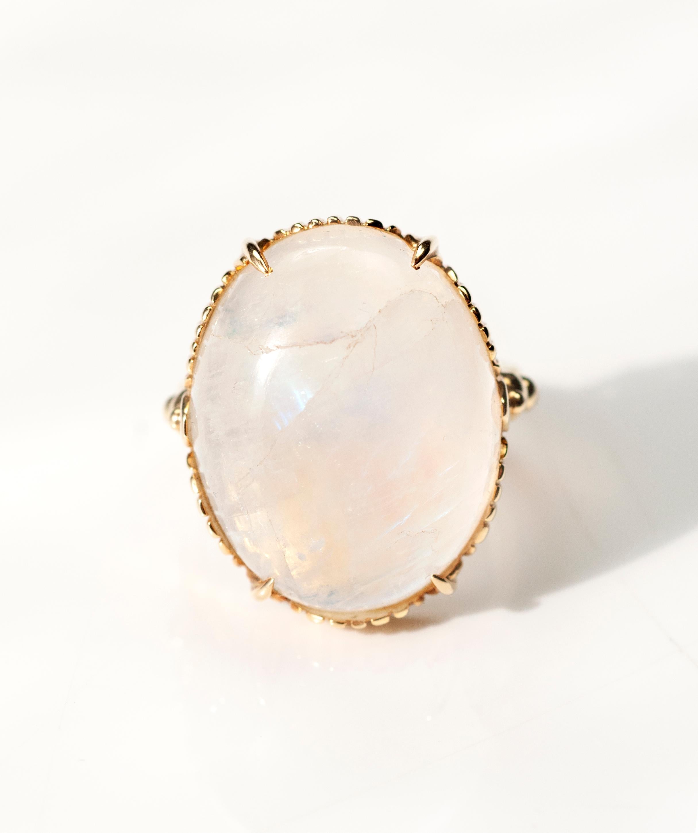 Rainbow Moonstone 27.00cts with 18K yellow gold basket and 14K yellow gold shank. Size 7, can be sized up or down a size.

Like their evocative namesake, the moon, moonstones have inspired quite a bit of romantic lore. People have associated