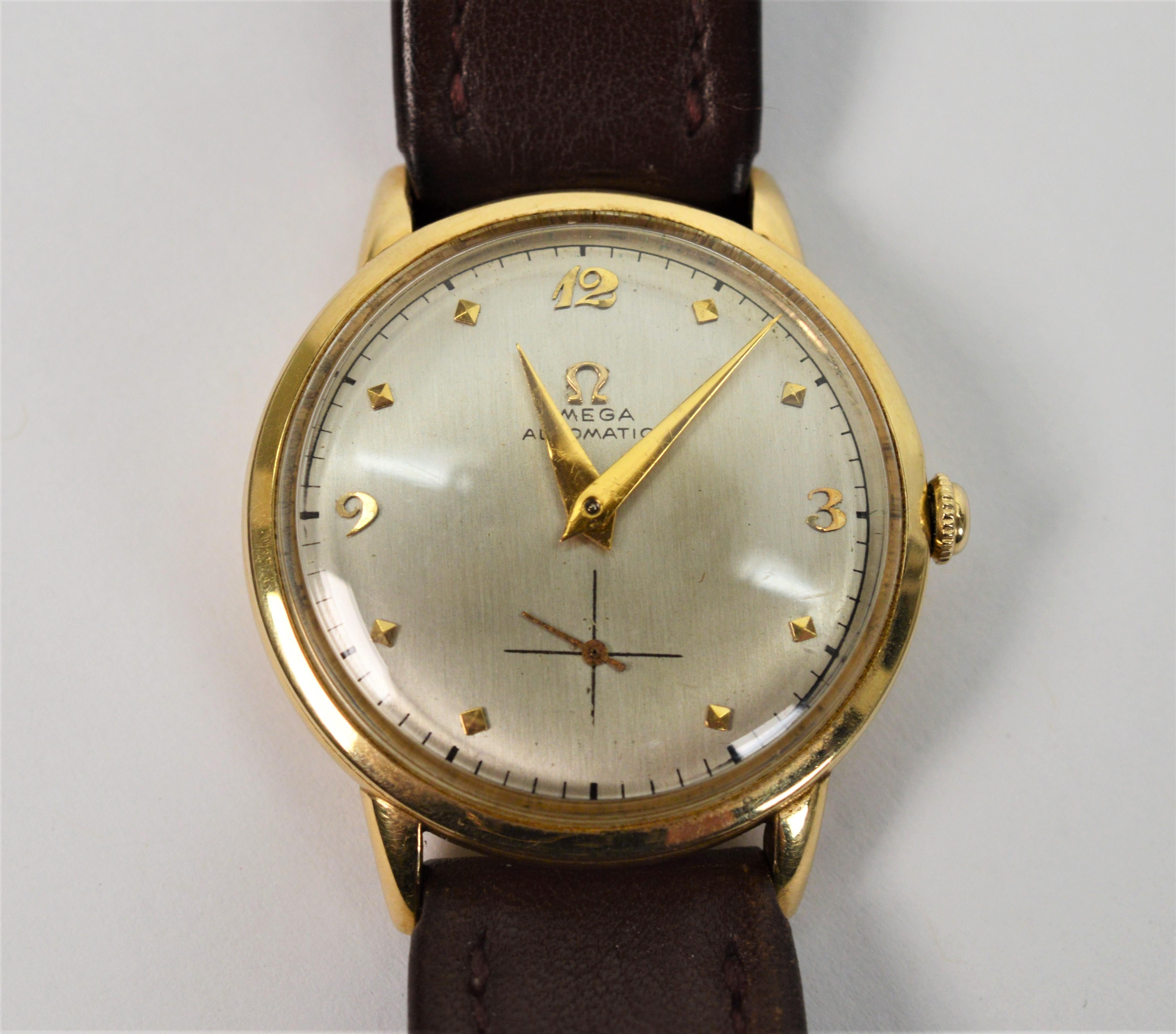 Among the first of the automatic Omega movements, this circa 1947 fourteen karat 14K yellow gold Men's Omega Wrist Watch Model 342 is with unrestored silver toned dial, gold markers, secondary second hand and case (number 11847014) all in original