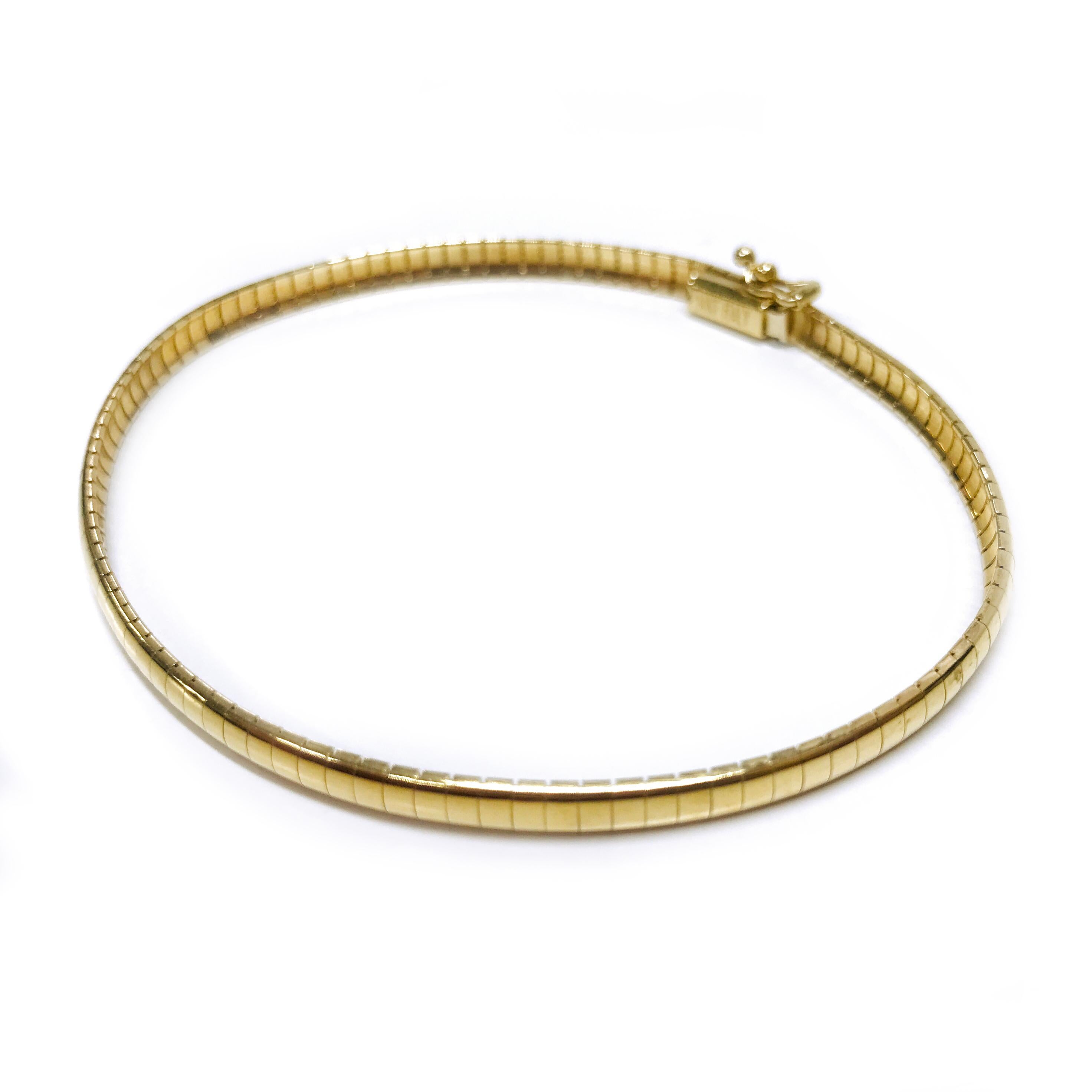 14 Karat Gold Omega Bracelet. The width of the bracelet is 4mm thick. The necklace has a box closure and safety eight. Stamped on the tongue is R and on the box clasp is 14KT ITALY. The total gold weight of the bracelet is 8.8 grams and the bracelet