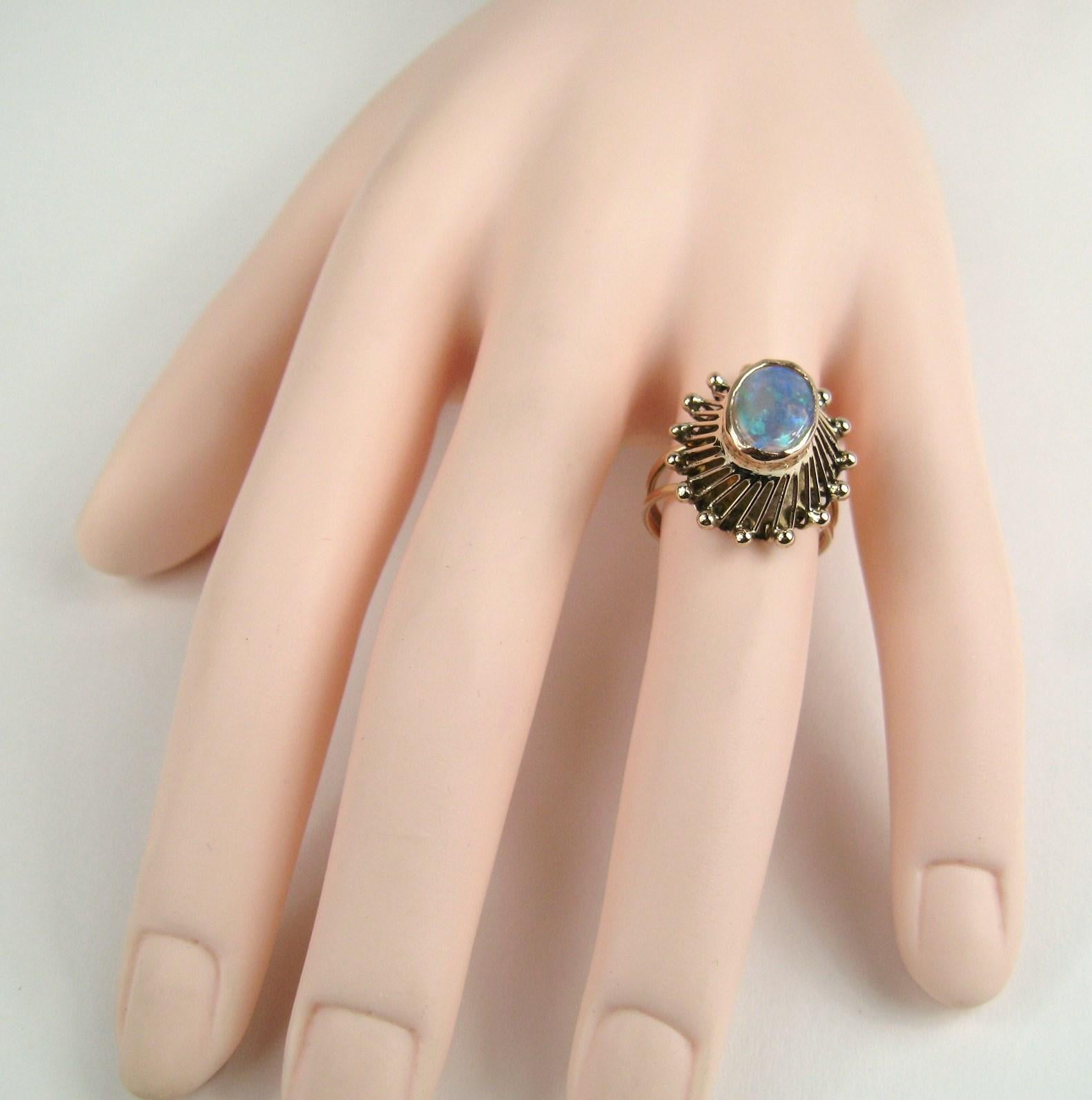 14K Gold Cocktail Ring with center opal stone. Sits up high on your finger (.44in) Ring is a size 7 and can be sized by us or your jeweler. Be sure to check our storefront for the matching pieces as well as hundreds of pieces of Fine, costume