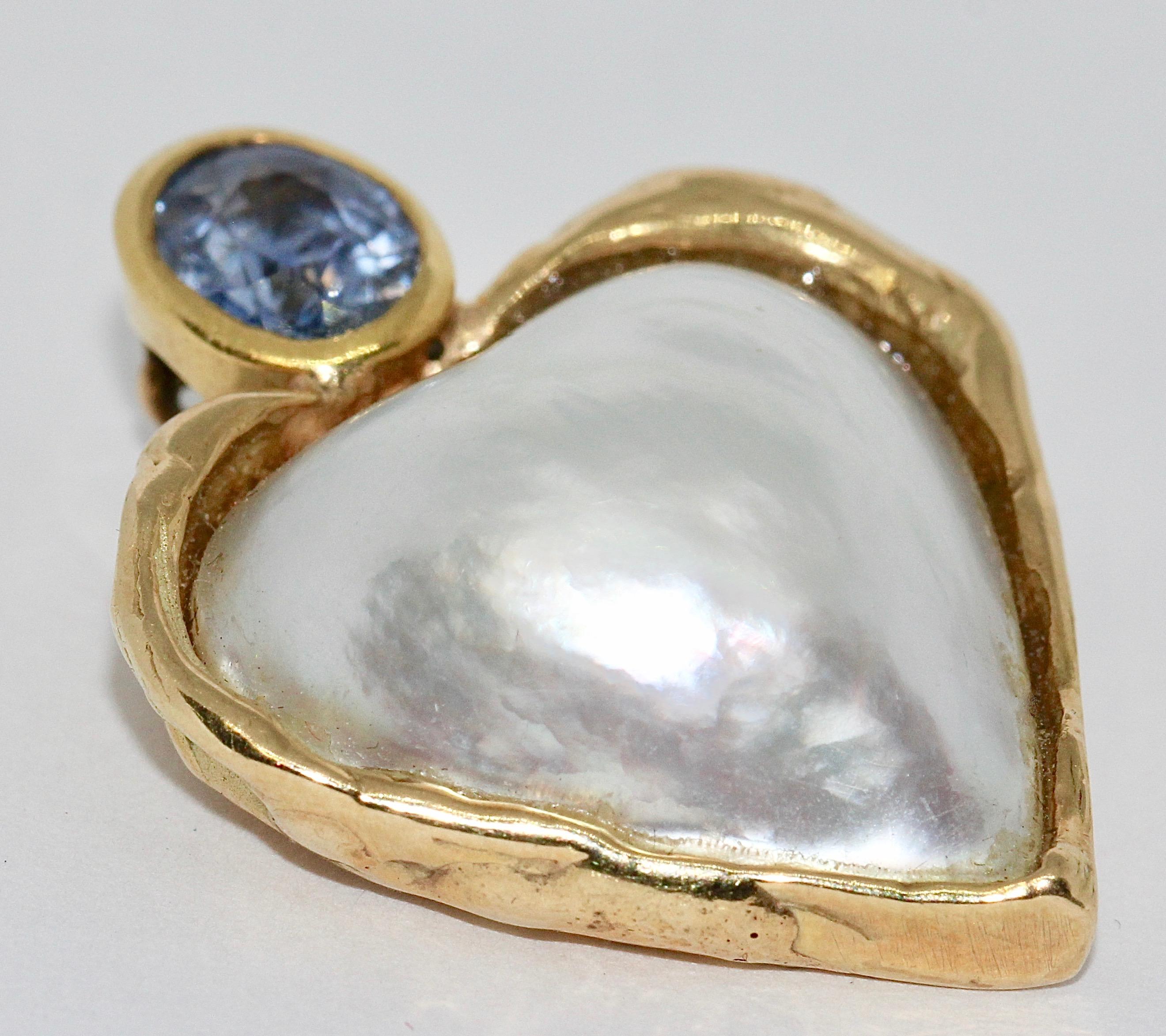 14 Karat Gold Pendant Enhancer, as Heart. With Mabé Pearl and Sapphire.

Hallmarked.