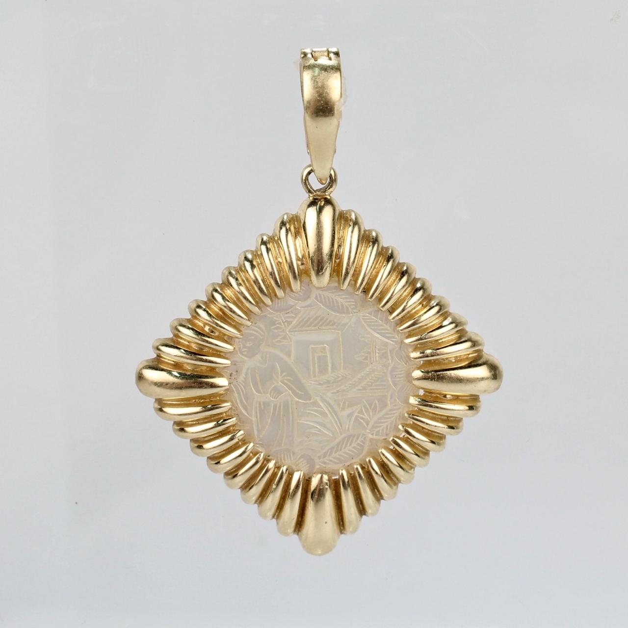 A fine 14 Karat yellow fluted gold pendant for a necklace set a Chinese mother of pearl fiché or gaming chip. 

The chip engraved on the front with a landscape scene including a house and Chinese man and with a landscape scene with bird on the