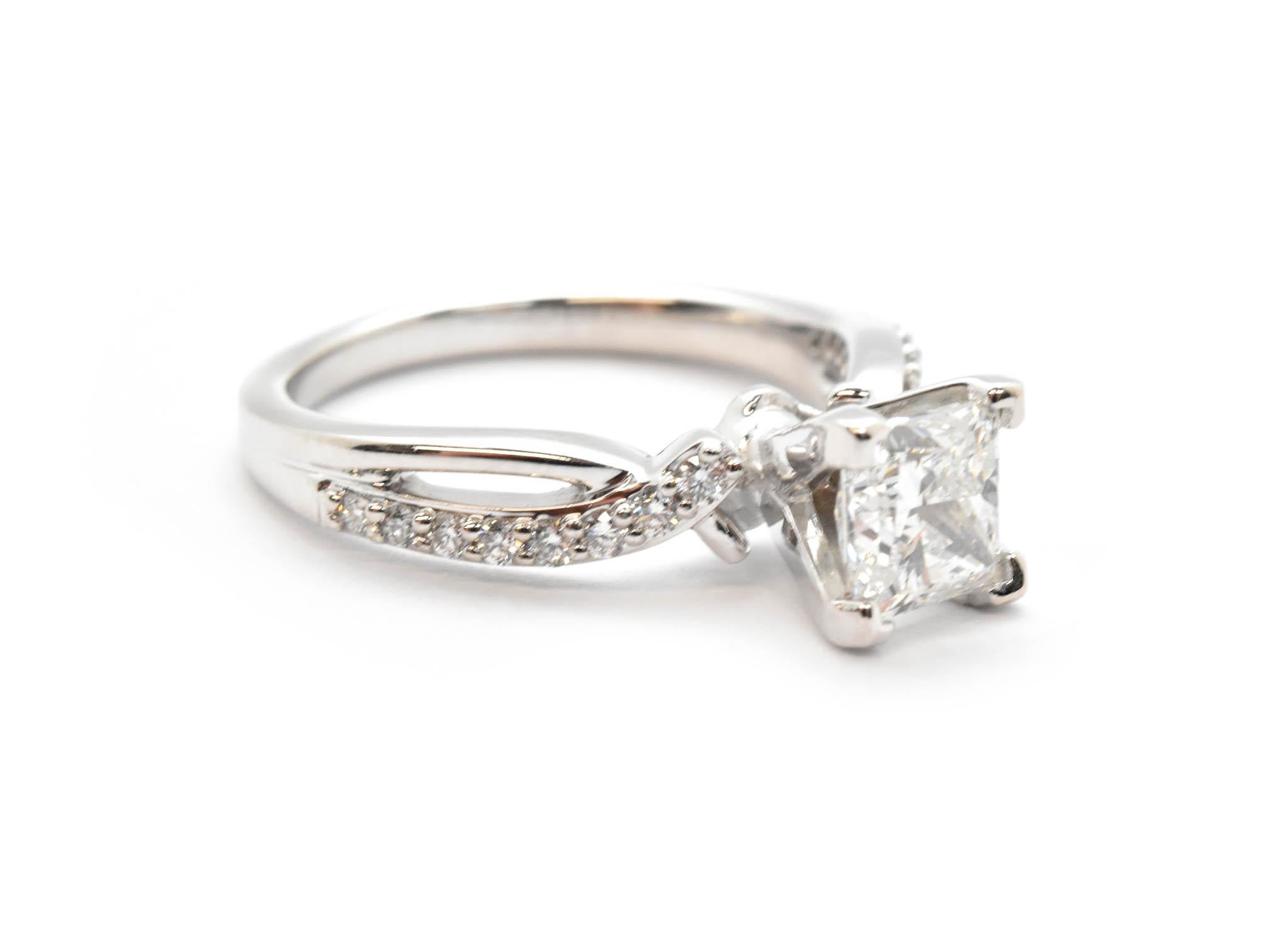 Make this princess cut diamond engagement ring symbolic of your romantic commitment, this engagement ring is designed in 14k white gold and set with a beautiful 1.01ct princess center stone. The center stone is held in place by 4 white gold prongs