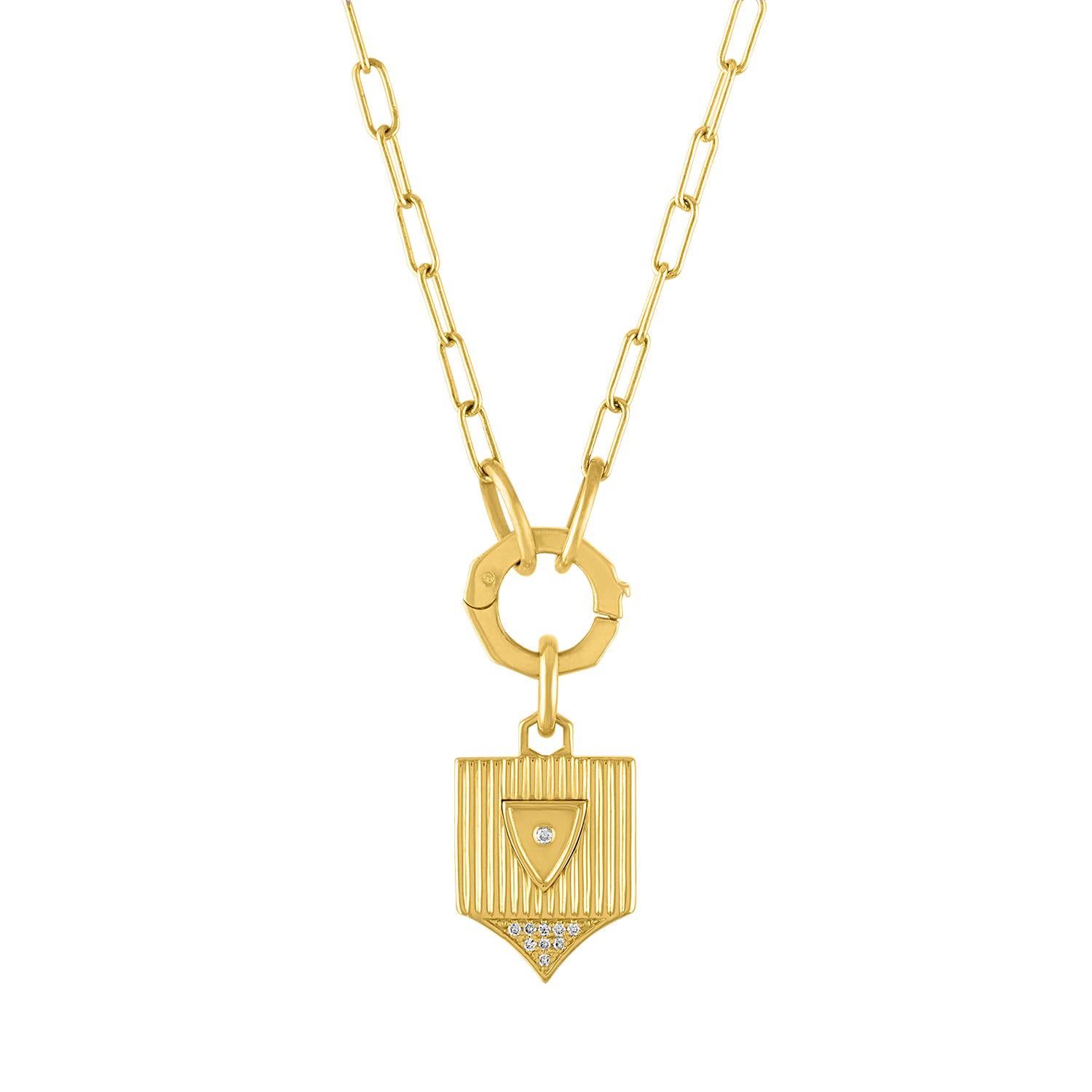 A rectangular link chain, finished with large jump rings, provides the setting for our pendants to be layered.  The chain holds a chunky, hexagon charm holder to mix and match with our shields.  The look of these components together is bold and