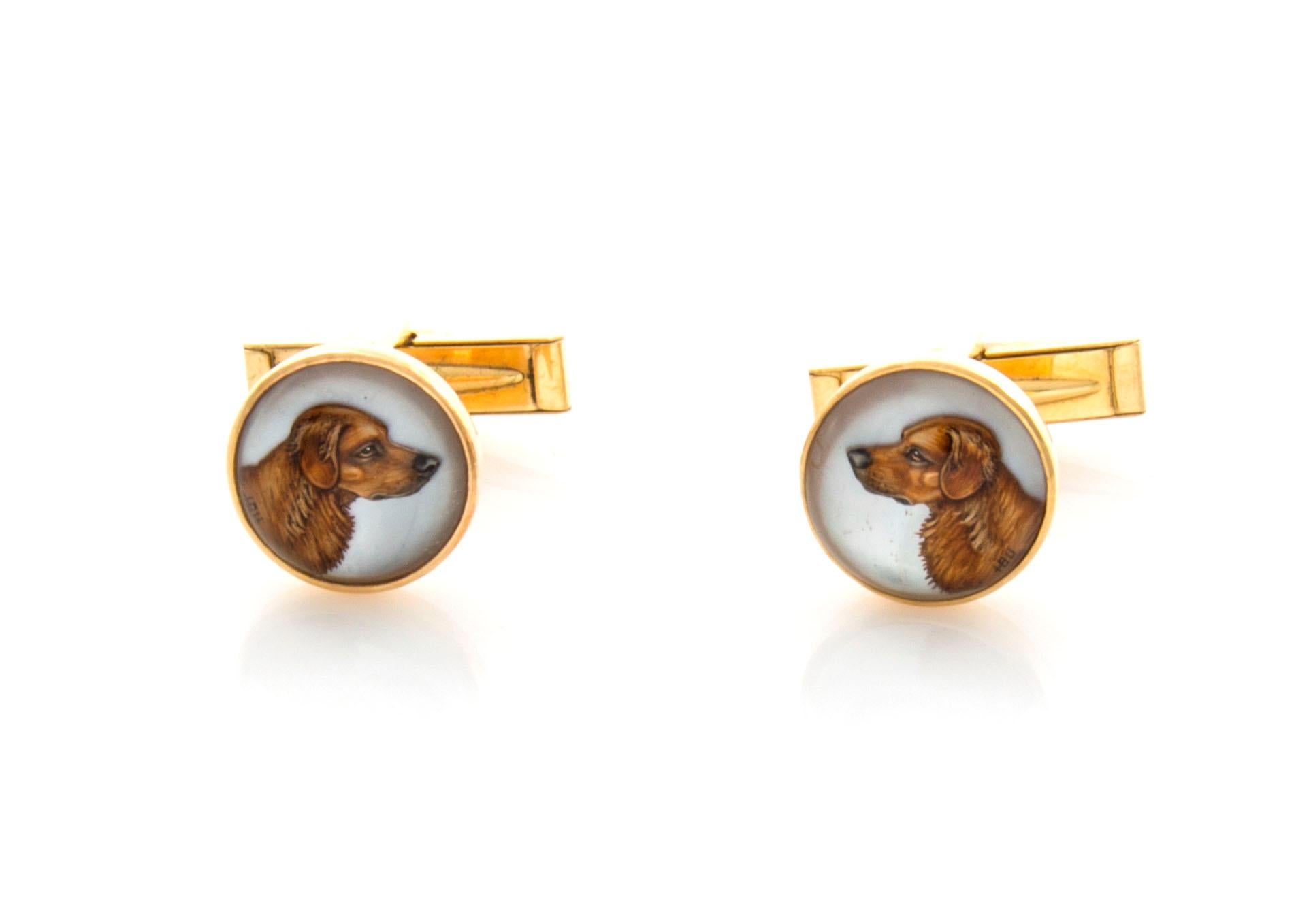 15 mm in diameter, these hunting motif cufflinks with a dog have wonderful detail, multi colors and fine three dimensional painting. Made of 14k gold with whale backs. Artist signed. A reverse crystal intaglio is a rock crystal cabochon with an