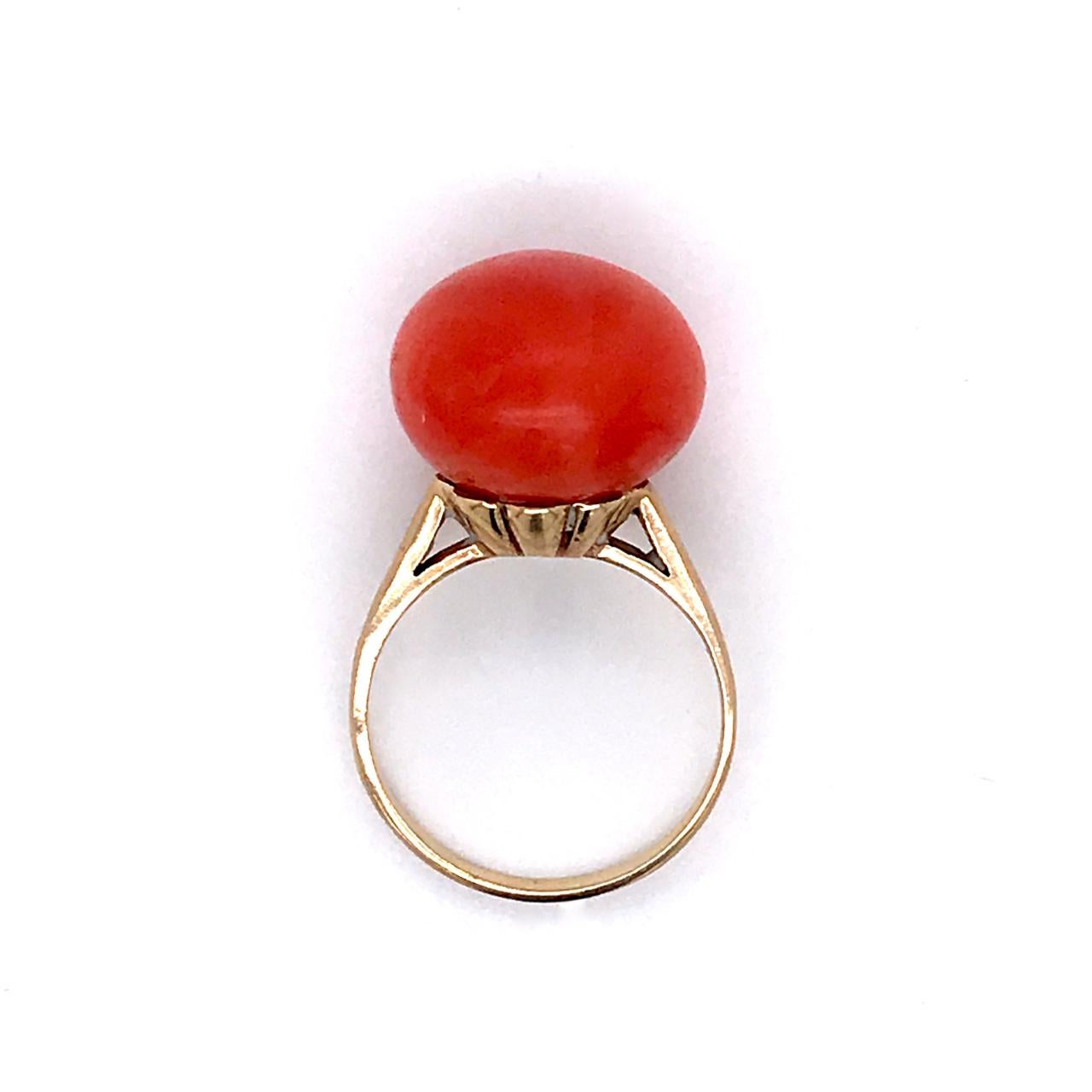 A very fine vintage gold and coral ring.

With a rich salmon or almost red coral button cabochon set in 14k yellow gold setting.

Marked to the shank 14k for gold fineness. 

Ring Size: ca. 5 1/2
Height: ca. 31 mm
Width: ca. 18 mm

Items purchased