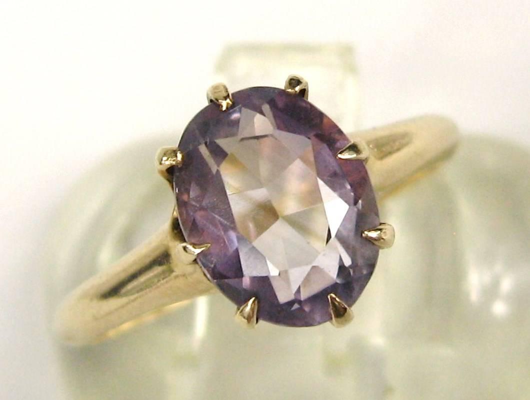 Victorian 8 claw prongs holding an amethyst stone set in 14K gold. Oval amethyst stone. The ring is a size 8.5 and can be sized by us or your jeweler. This is out of a massive collection of New Old stock items as well as  Hopi, Zuni, Navajo,