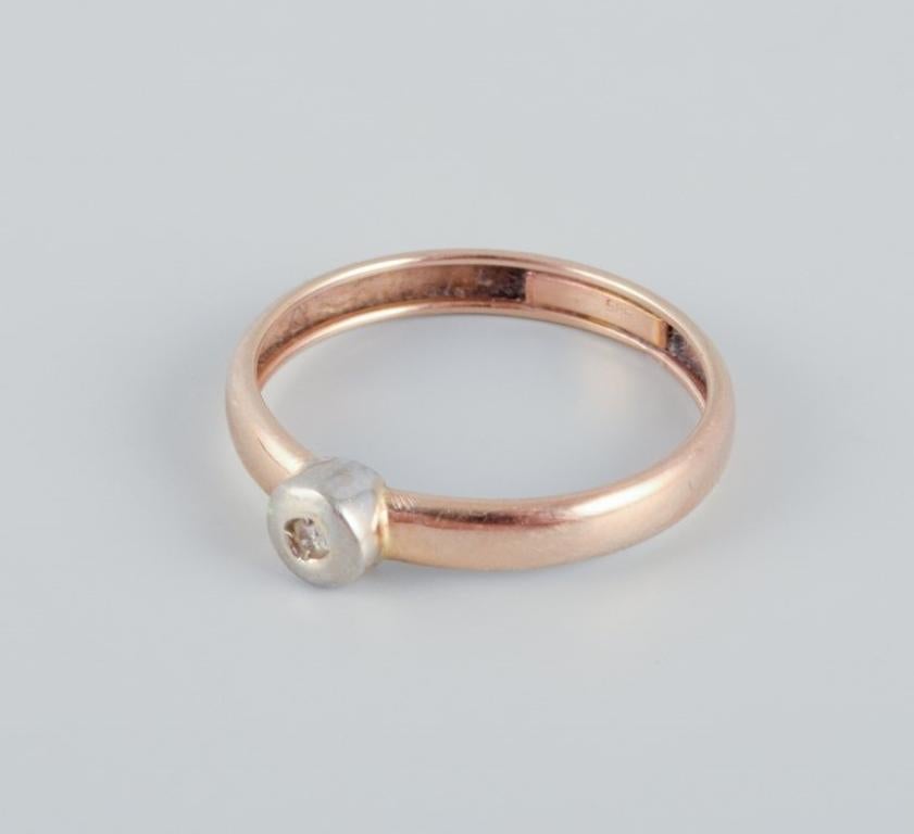 Brilliant Cut 14-karat gold ring with a small diamond in a modernist design.  For Sale