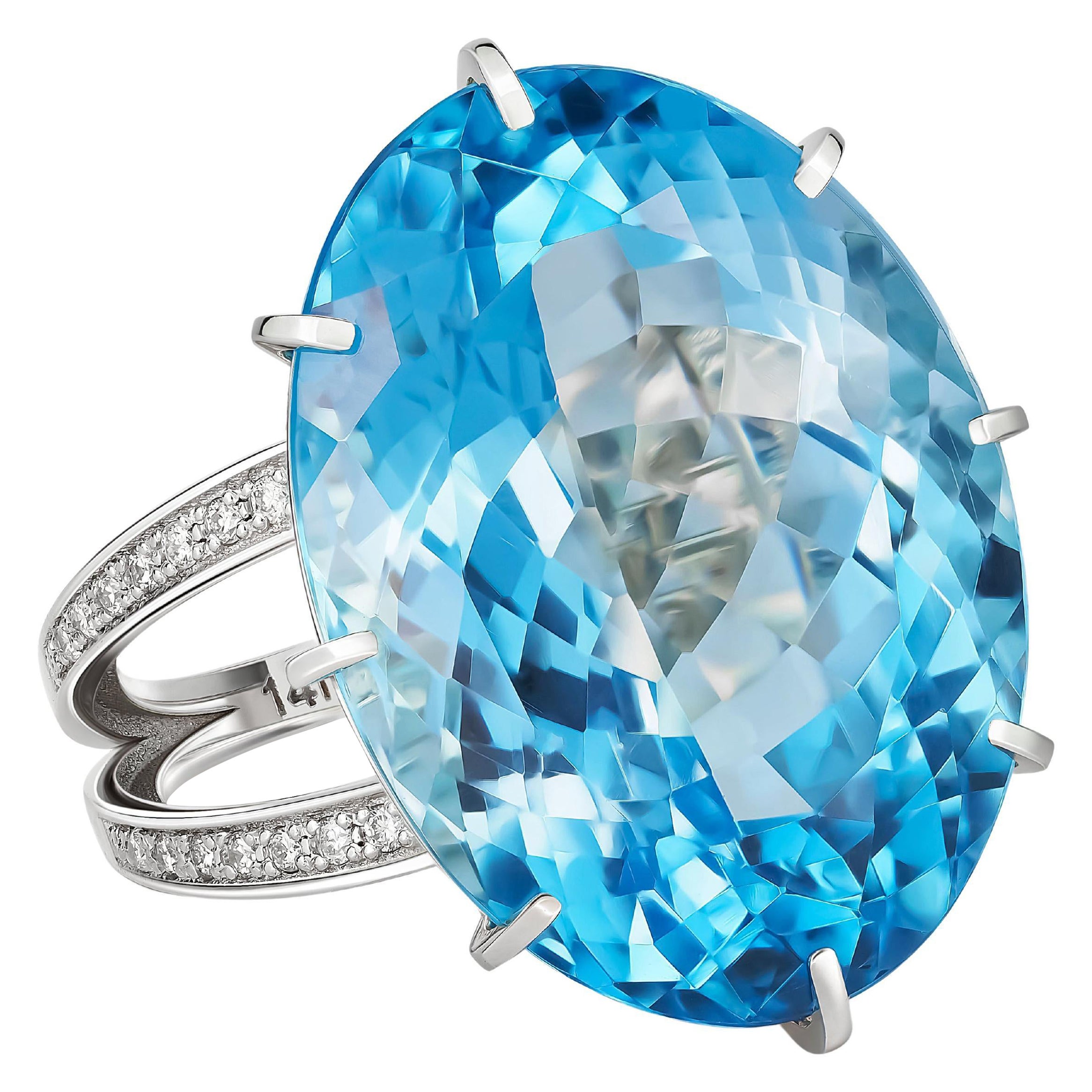 Massive ring with topaz and diamonds
14 ct gold
Weight: 10.1 g.
Set with topaz , color - blue
Oval cut, apx 26 ct. ( 21.5x15.5x 10.3 mm)
Clarity: Transparent with inclusions
Other stones:
Diamonds - round brilliant cut, G/VS, 32 x 0.009 ct, 0.28 ct
