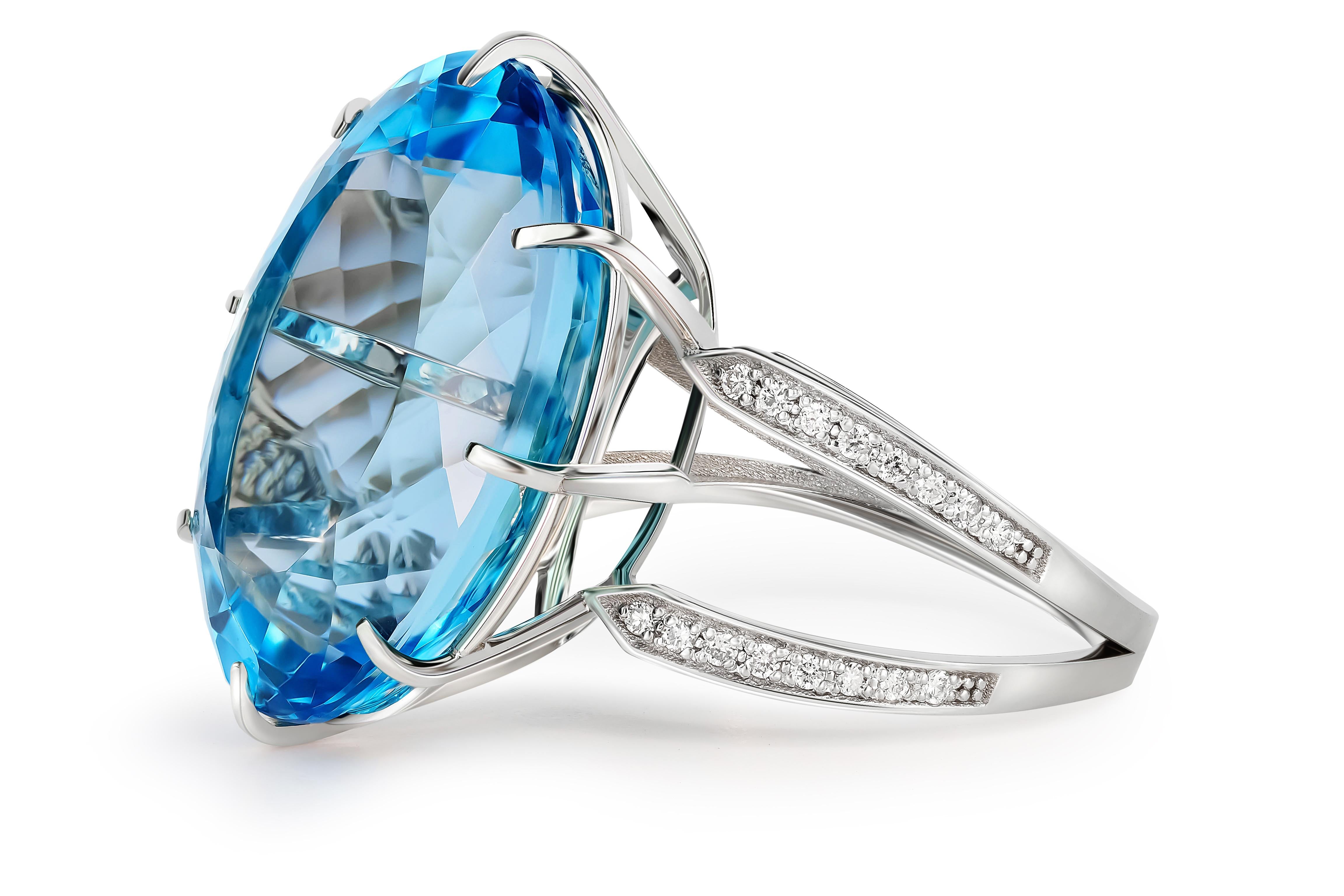 Modern 14 Karat Gold Ring with Oval Topaz and Diamonds, Gold Ring with Sky Blue Topaz For Sale