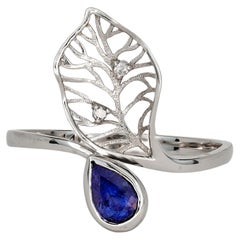 14 Karat Gold Ring with Sapphire and Diamonds. Floral Design Ring with Sapphire