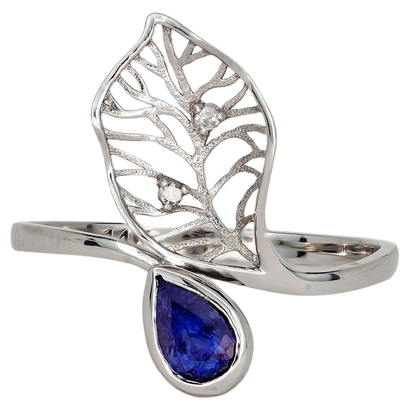 14 Karat Gold Ring mit Saphir und Diamanten. Ring mit floralem Design und Saphir