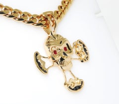 14 Karat Gold Skull Pendant with Black Diamonds and Rubies