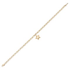 Bracelet à breloques étoile en or 14 carats. Bracelet chaîne avec pendentif en forme d'étoile.