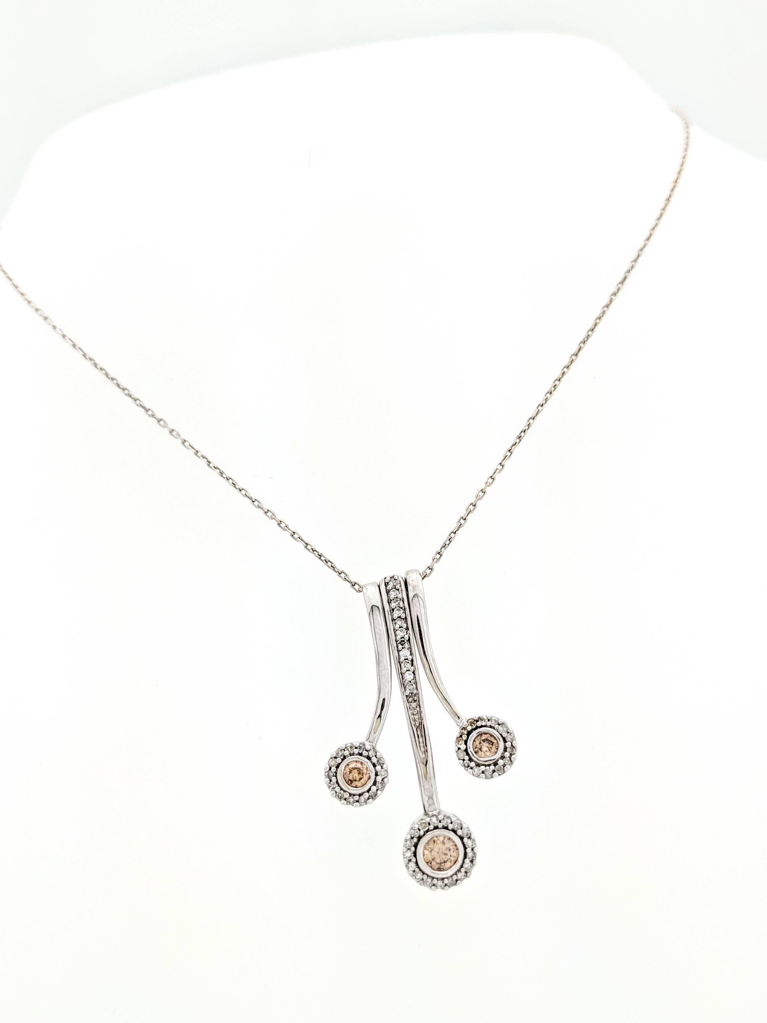 14K White Gold 3-Piece Champagne & White Diamond Halo Pendant Necklace 

You are viewing a beautiful Champagne & White Diamond Halo Pendant/Necklace. This pendant features 3 individual pieces that slide together to make the look of one. Each piece