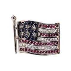 14 Karat Gold Waving "American Flag" Pin with Diamonds, Rubies and Sapphires
