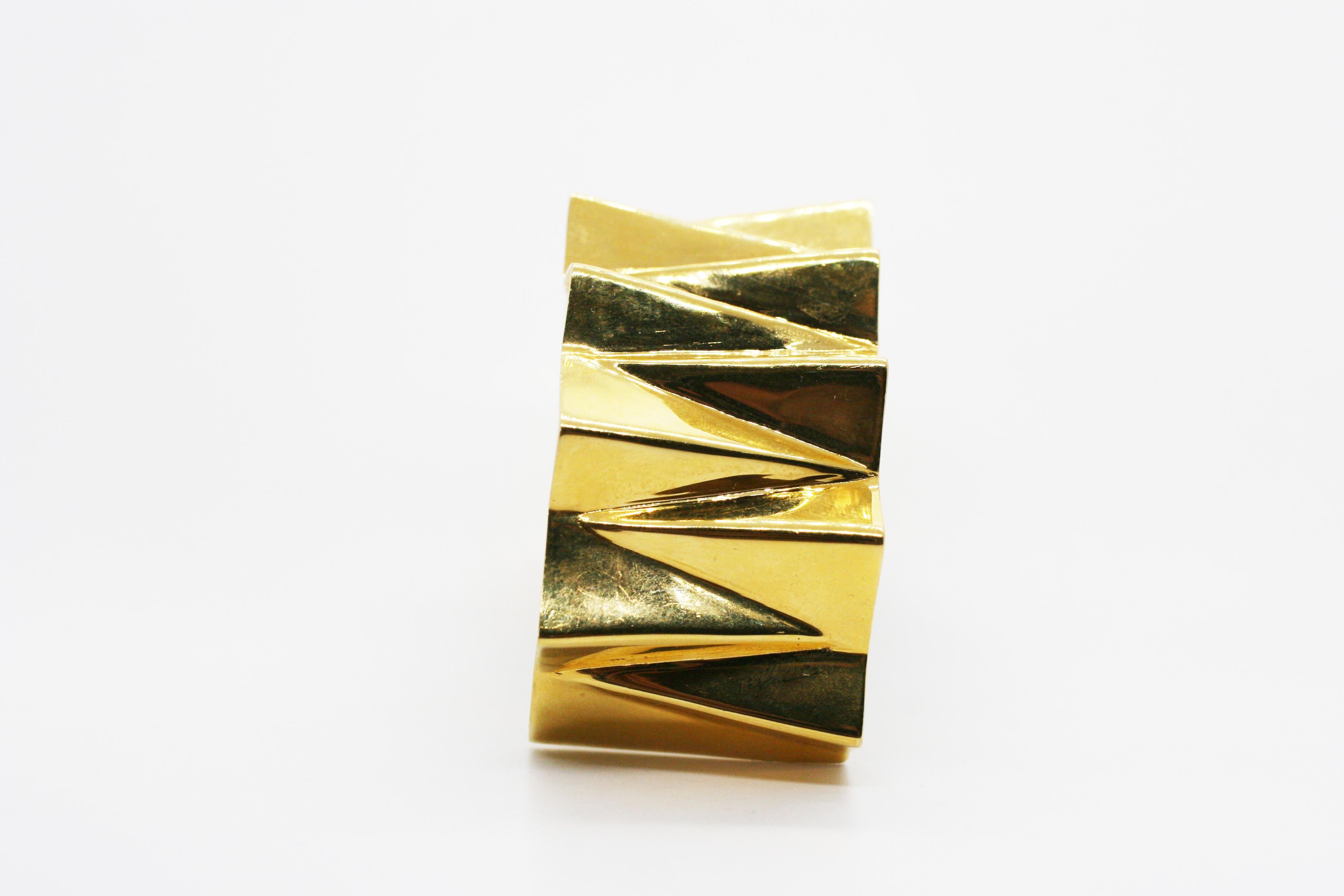 14k Gold Wide Folded Triangles Cuff features three dimensional triangles that curve over the wrist in alternating directions with an opening at the bottom to easily slide onto the wrist
Style with Perez Bitan's Sterling Silver Wide Folded Triangles
