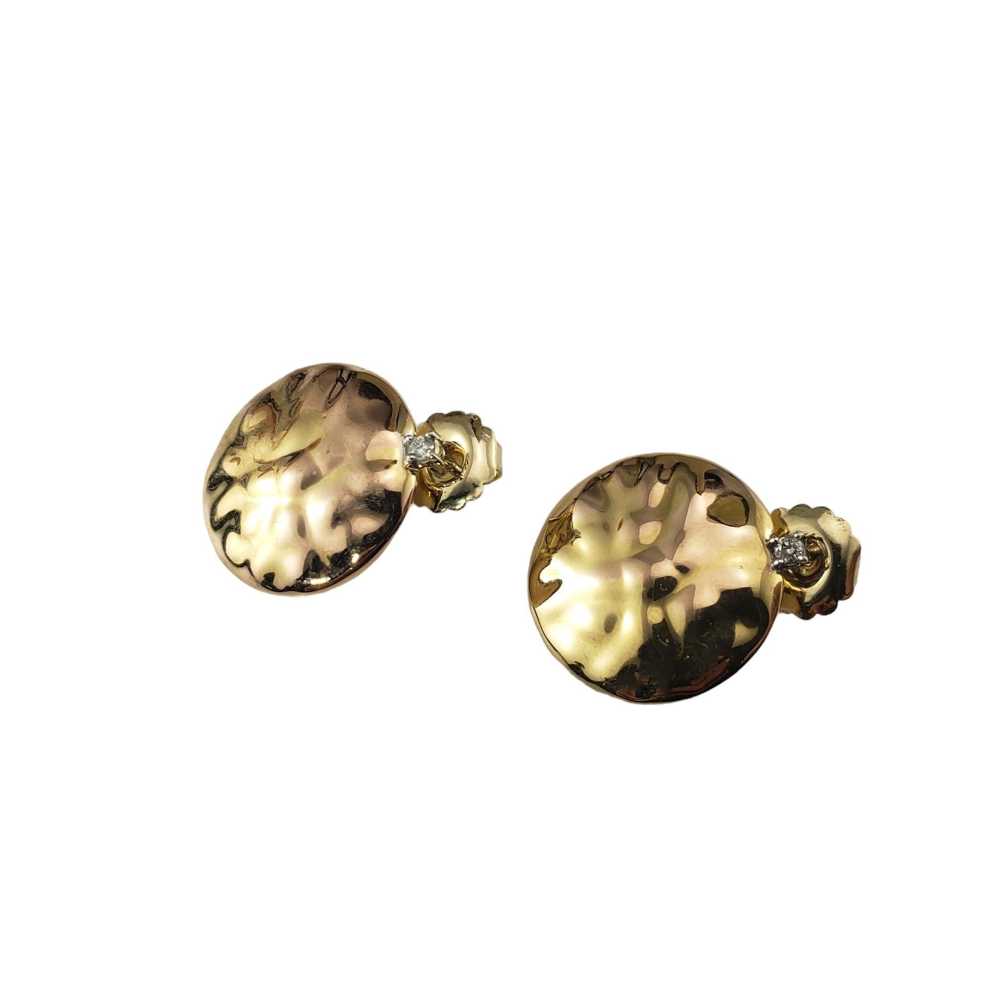 Vintage 14K Hammered Yellow Gold and Diamond Earrings-

These elegant earrings each feature one round brilliant cut diamond set in beautifully detailed hammered 14K yellow gold. Push back closures.

Approximate total diamond weight: .06 ct.

Diamond