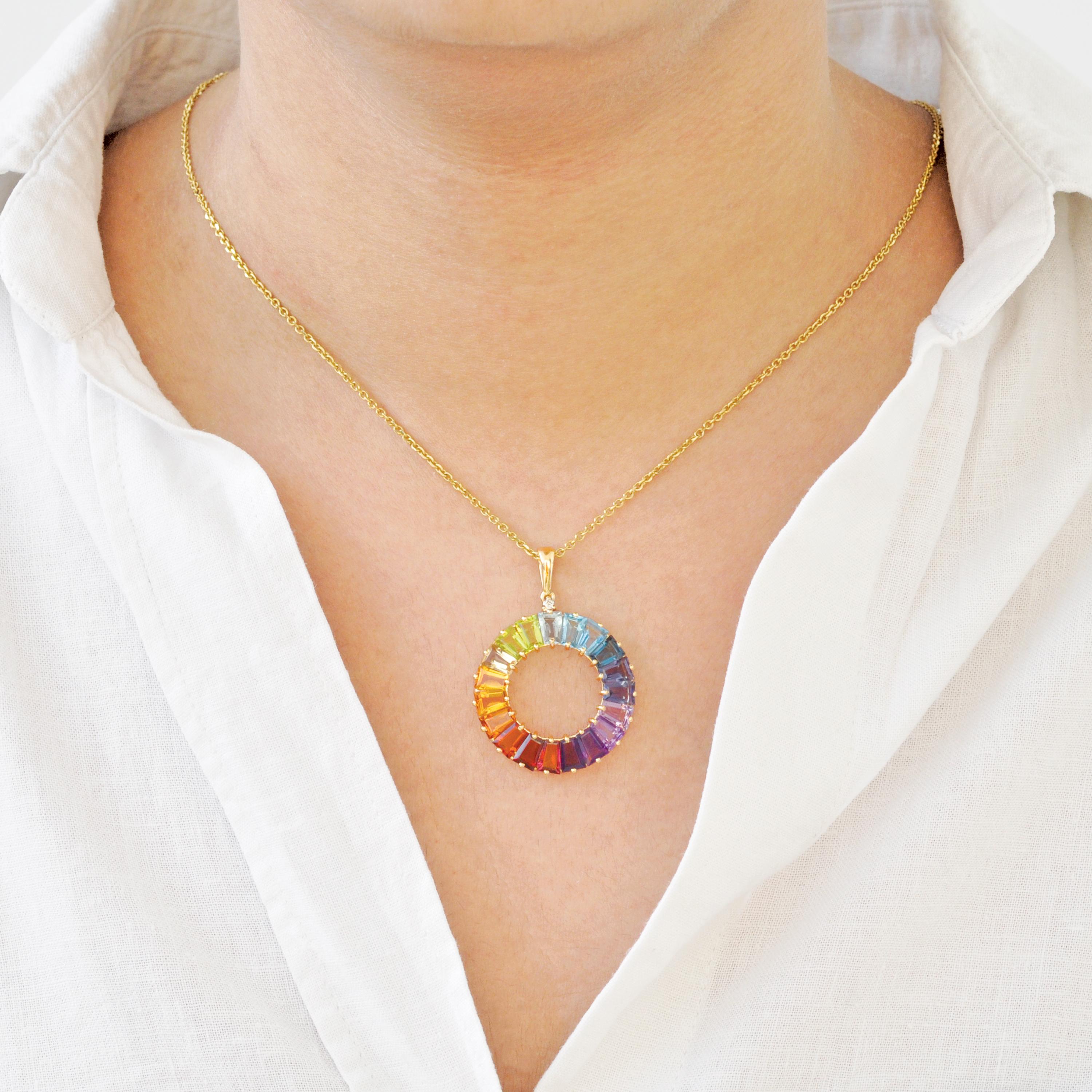 14K Gold Rainbow Circle Pendant with Natural Tapered Baguette Gemstones

This vibrant and eye-catching pendant is expertly crafted in 14-karat gold, featuring a stunning array of natural gemstones arranged in a graceful circular motif. The design