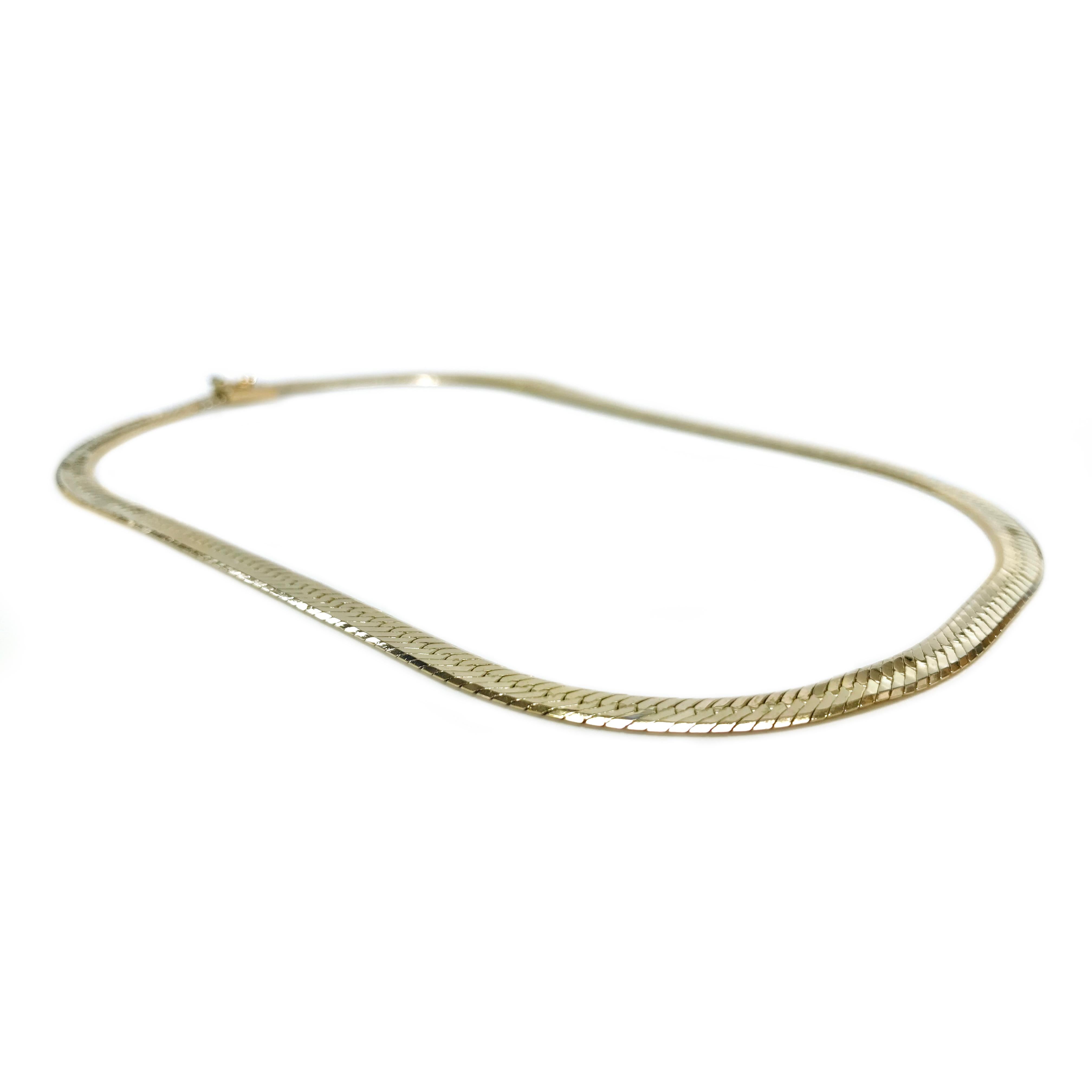 14 Karat Herringbone Necklace. The necklace is 0.53mm thick, 6.2mm wide and 17