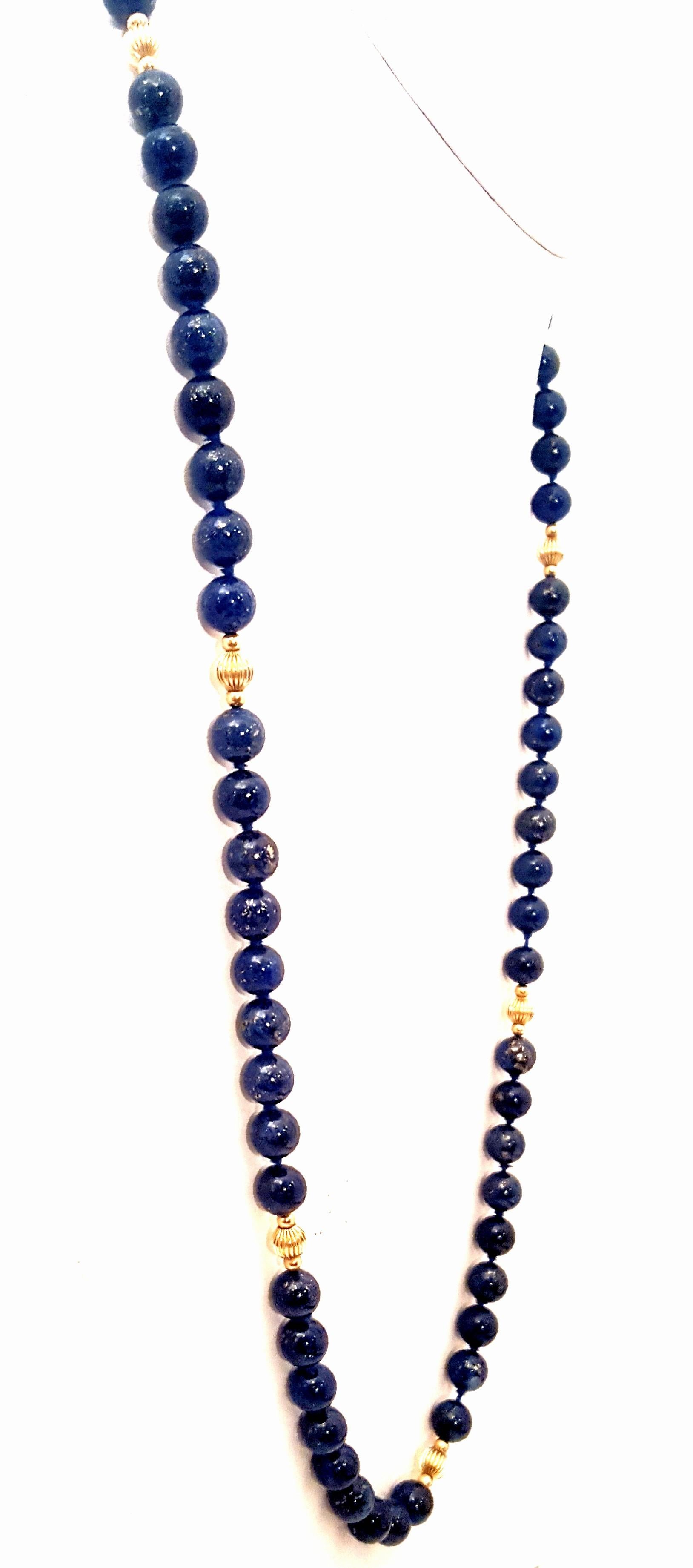 Veins of glinting yellow pyrite randomly light up these 8.5mm lapis beads.  The intense blue color is quite stunning.  This 32