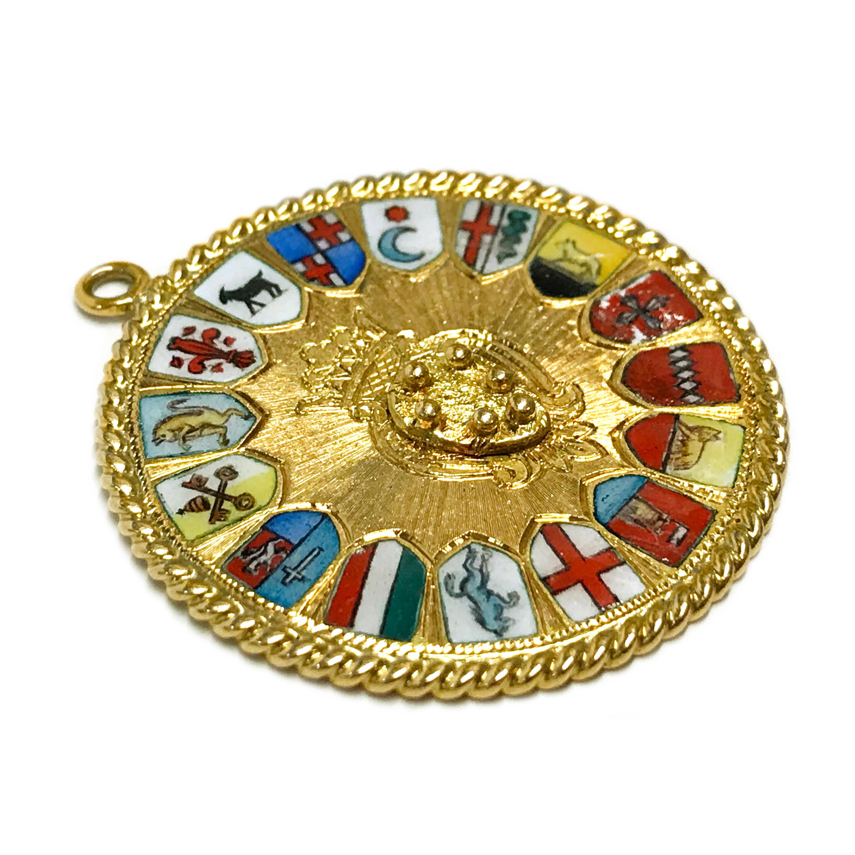 14 Karat Italian Coat of Arms Medallion Pendant. The pendant measures 34.98mm in diameter. The front and back of the pendant have a radial texture. The front of the pendant has an engraved crest with a crown and all around are enamel Italian coat of