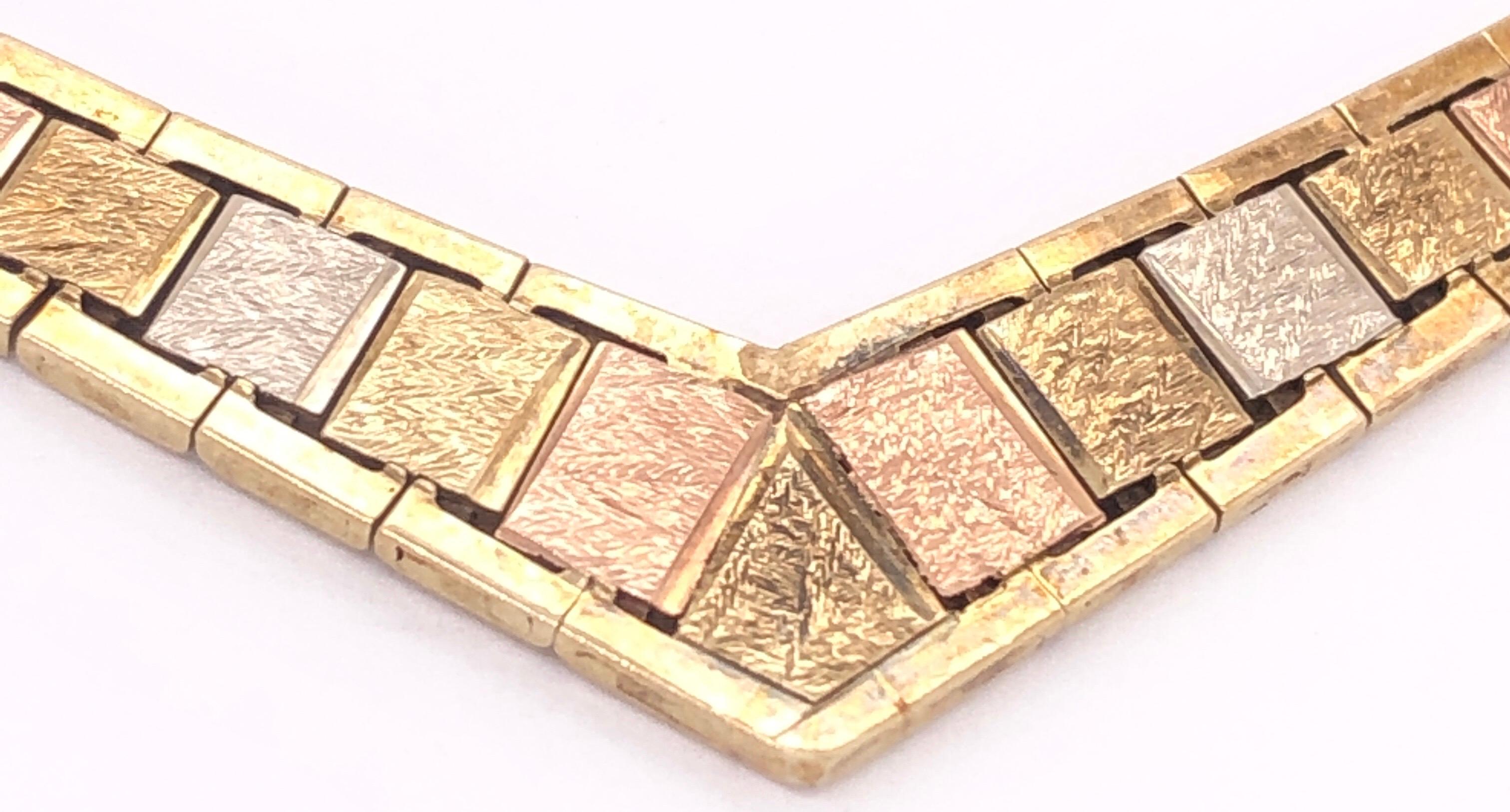 14 Karat Italian Three Tone Gold 7 Inch Fancy Link Bracelet
11 grams total weight.
7mm width

