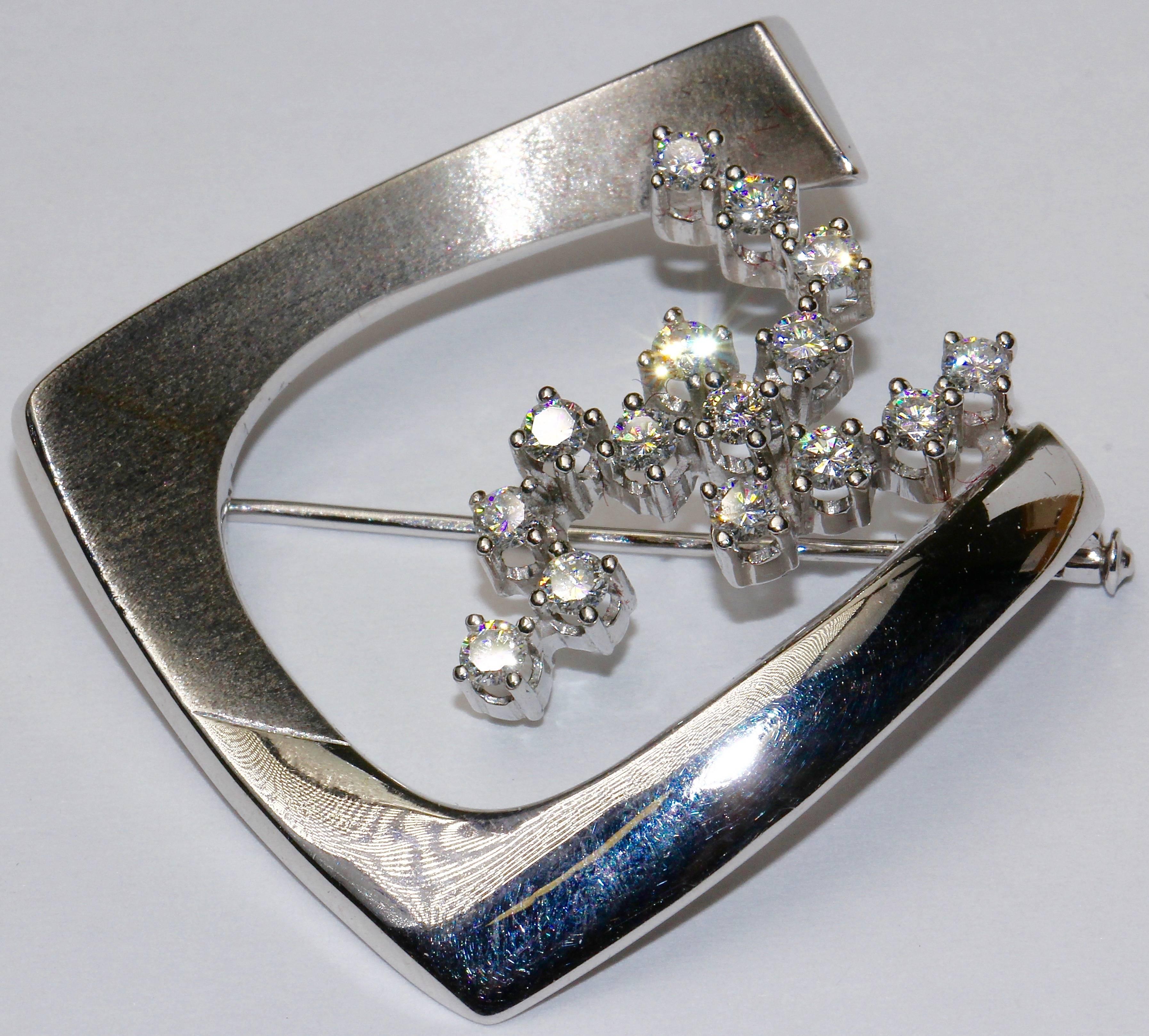 Stylish ladies white gold brooch set with 15 diamonds in TOP quality and a total weight of about one carat.
IF to VVS. White color.
Hallmarked.