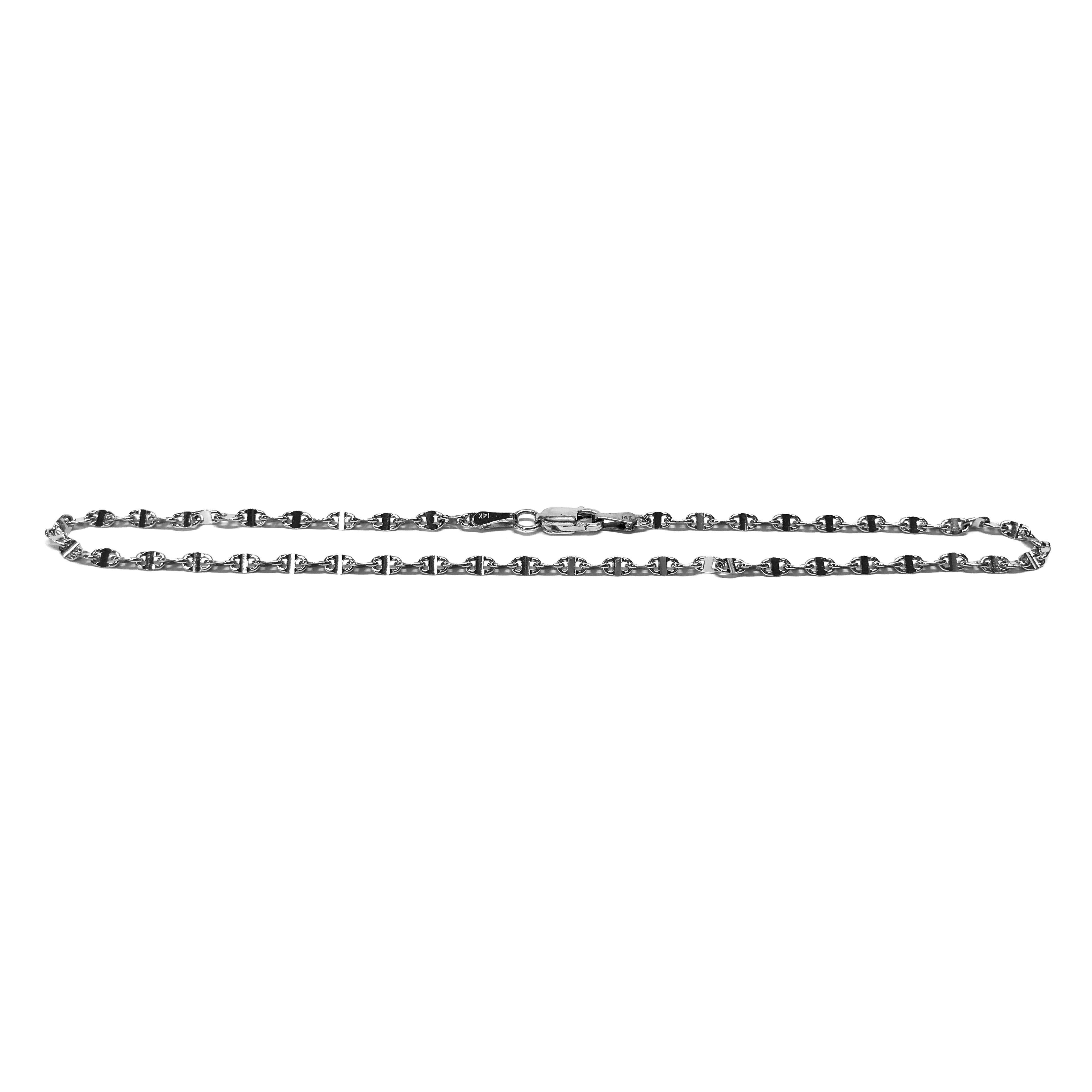 14 Karat White Gold Link Anklet. This anklet features Gucci-style links. The anklet is 11