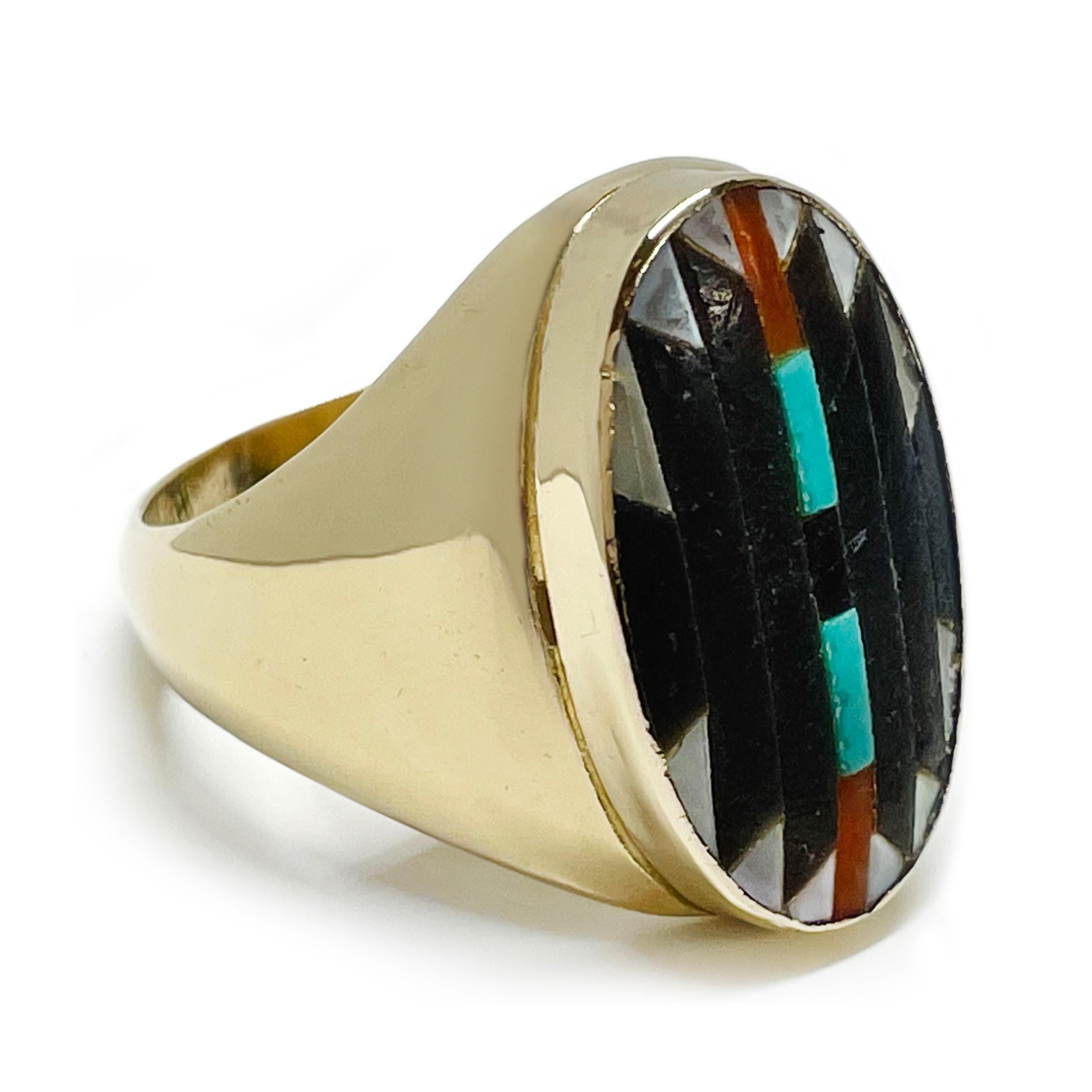 14 Karat Native American Ring. The ring features Onyx, Turquoise, Carnelian, and Mother of Pearl inlay in mosaic pattern. The wide band tapers and the finish is a smooth shiny gold all around. The ring size is 10 1/2. Stamped inside the band are the