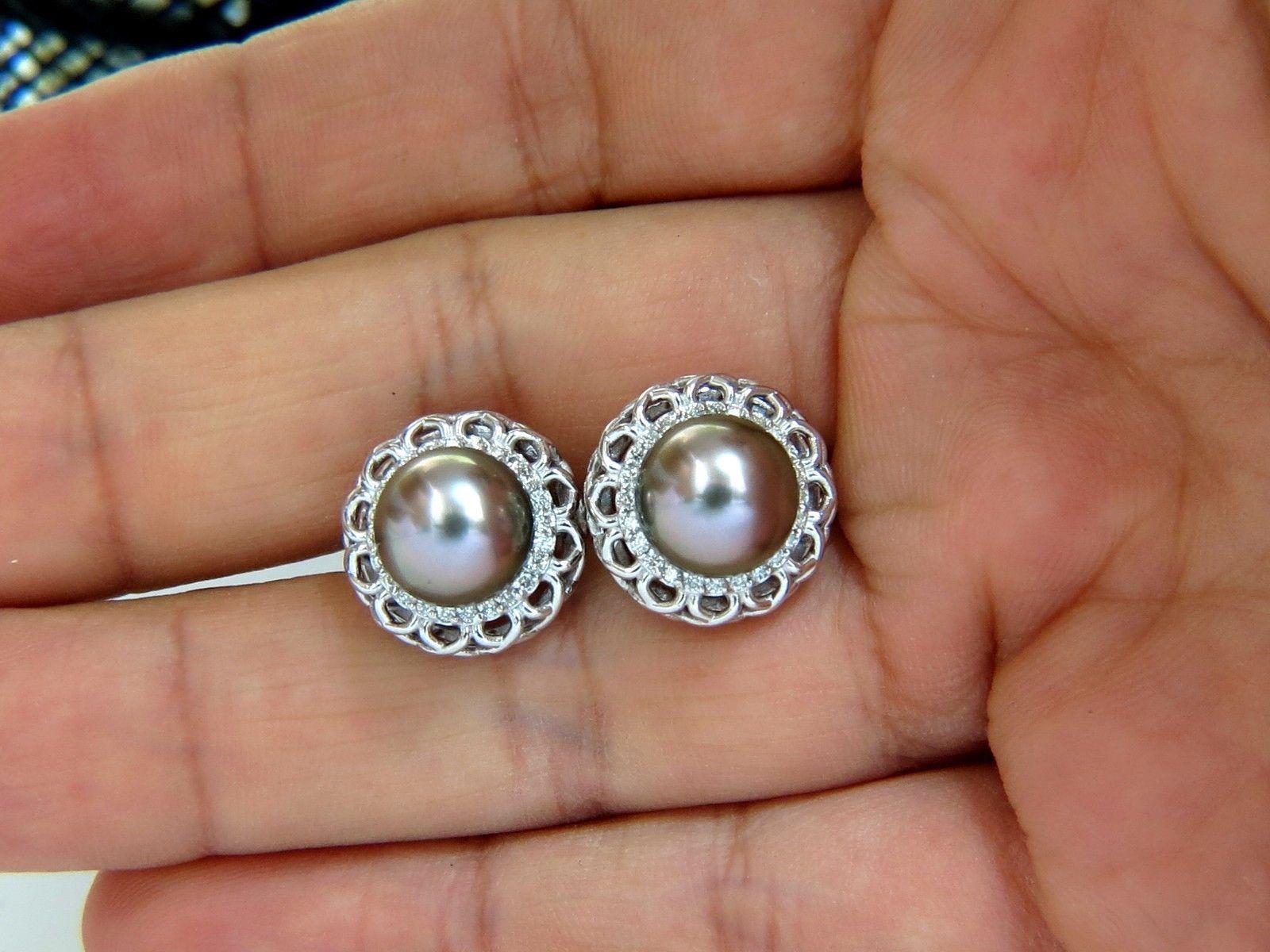 9.5mm Natural Tahitian Black Peacock pearl clip earrings

Pearls are natural, Black lipped oyster pinctada.

No pits, nicks or dents of any sort.

AAA Excellent Luster

Diamonds: .40ct. 

Rounds, full cut brilliants.

G-color VS-2 clarity

14kt.