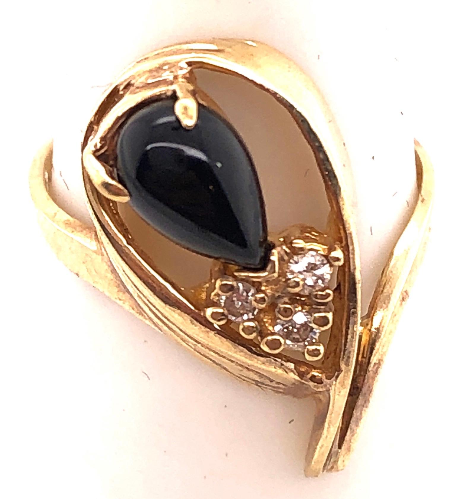 14 Karat Yellow Gold Free Form Onyx Ring with Diamonds 
0.03 Total Diamond Weight.
Size 6.5
 3.54 grams total weight.
